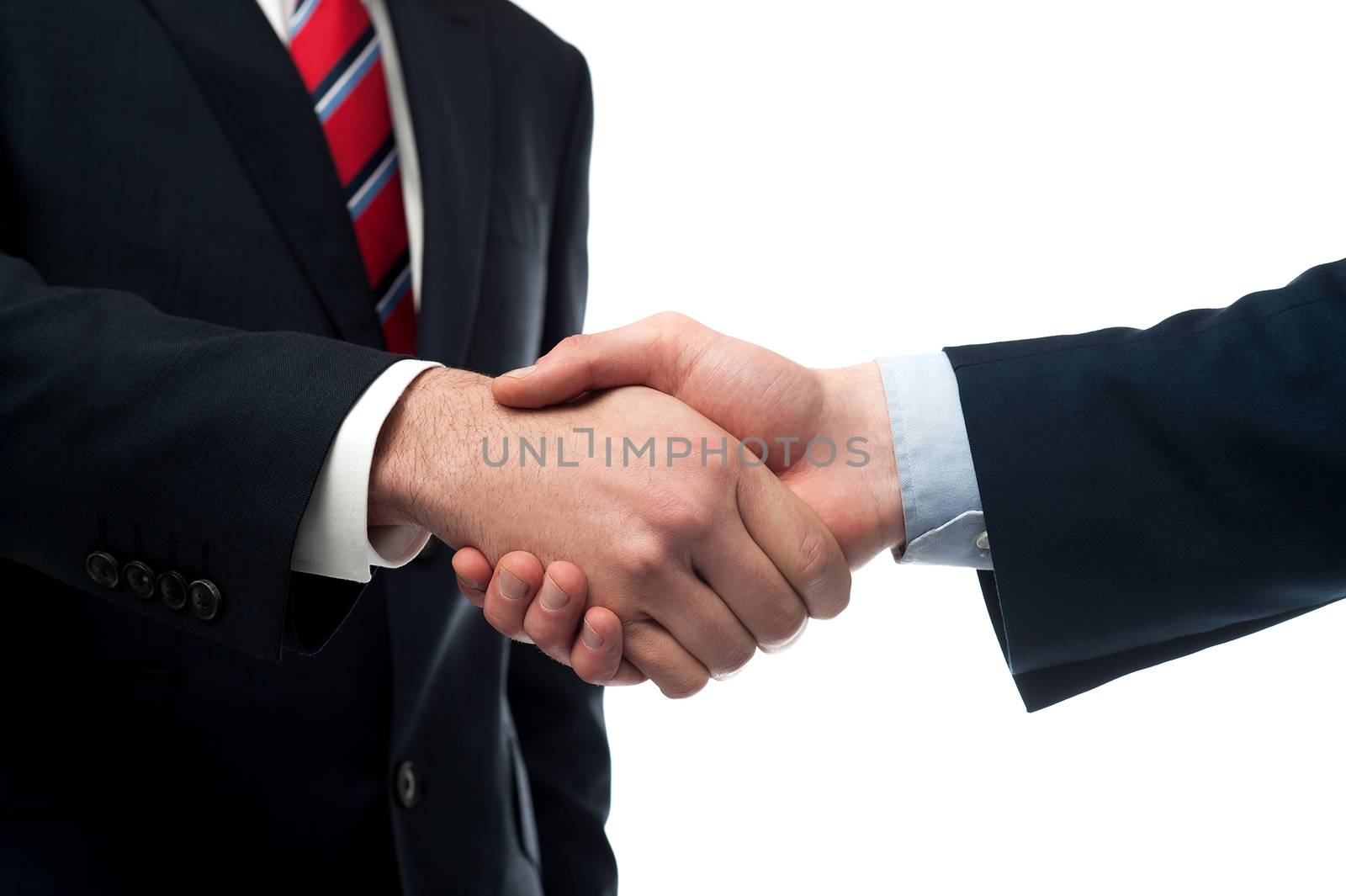 Cropped image of businessmen handshaking