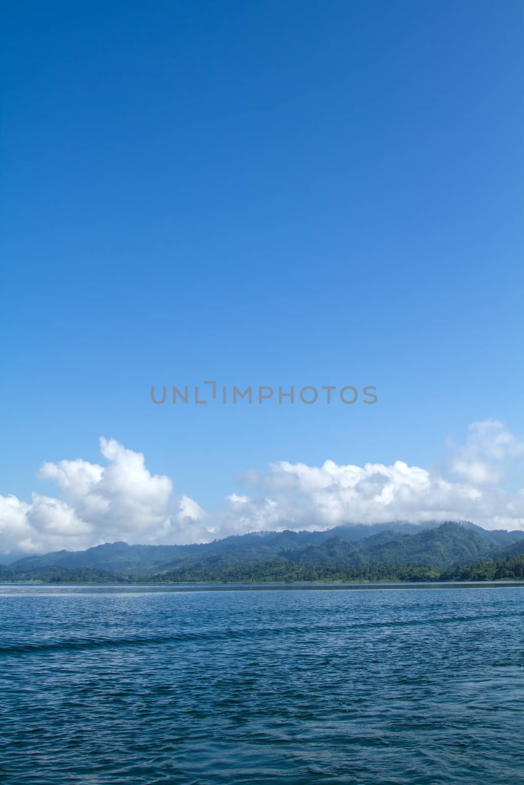 Lake mountain with clouds and blue sky