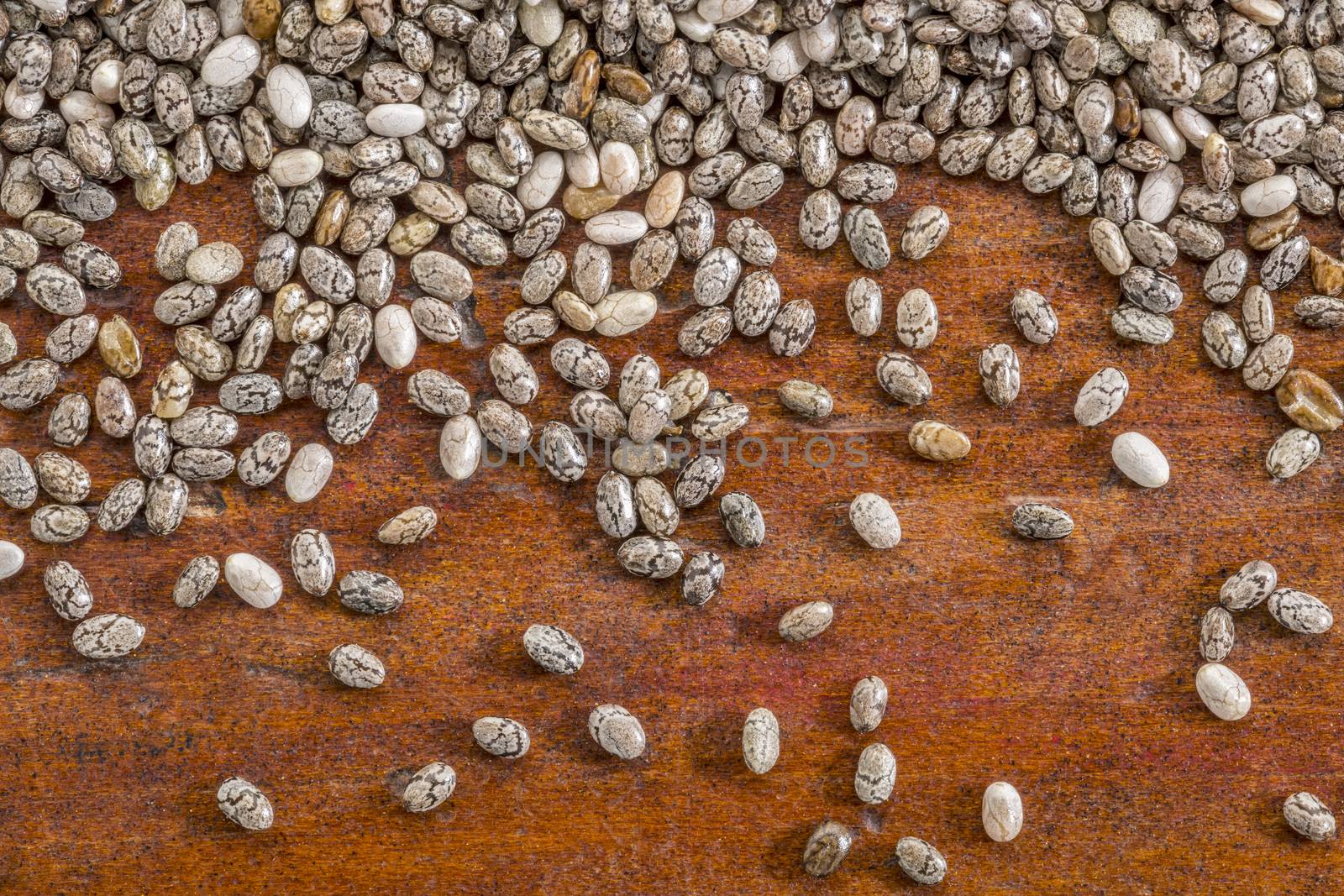 chia seeds on a rustic wood - close up background