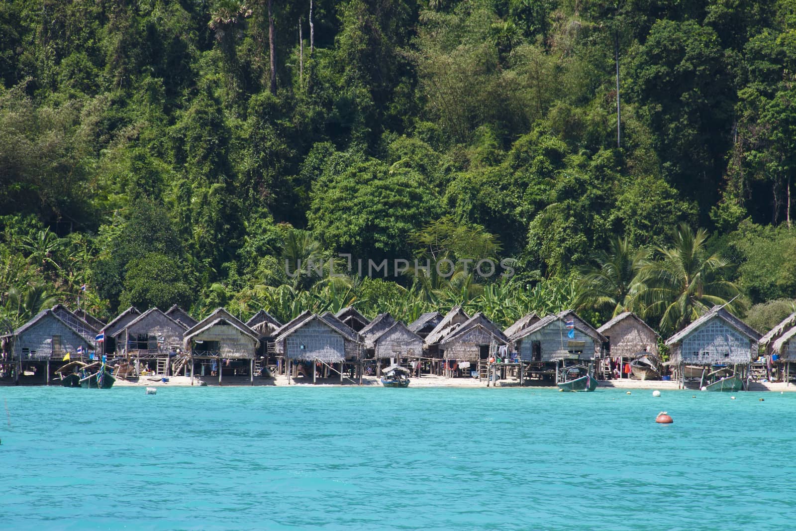 The Moken Sea Gypsy Village at Koh Surin Tai in the Mu Ko National Park, Surin Islands of Thailand with its thatched houses on stilts.