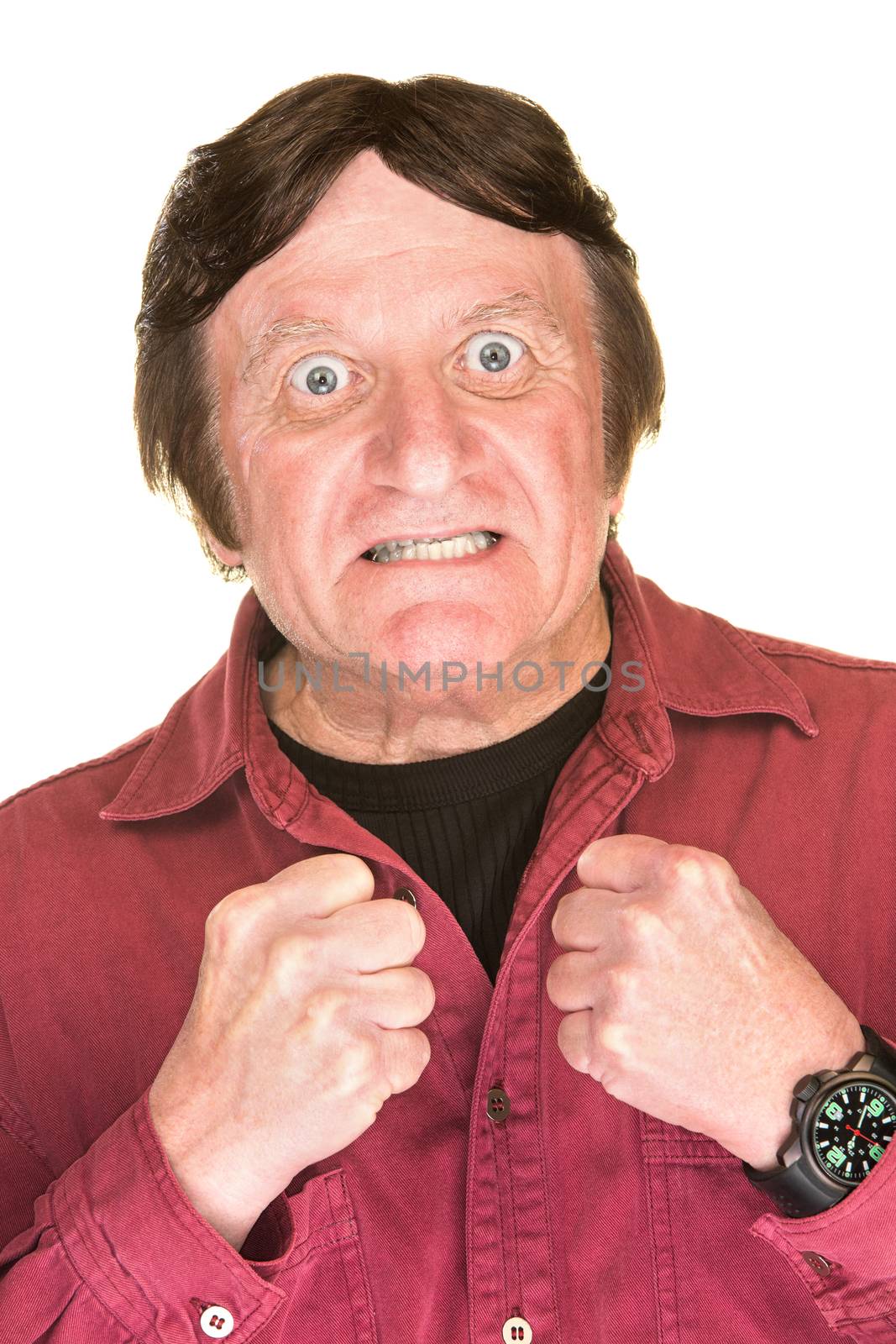 Enthusiastic mature man in red with clenched fists