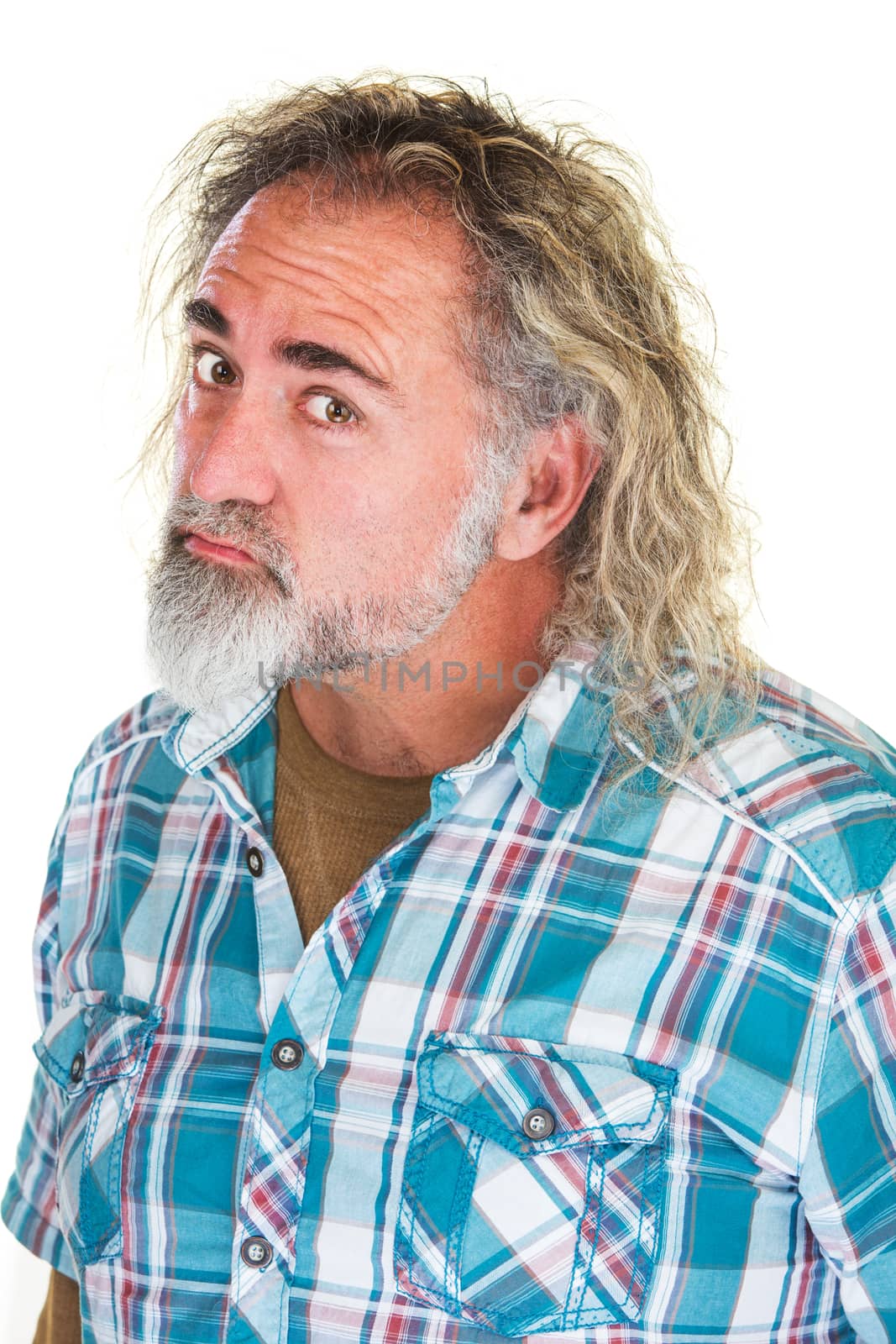 Insulted grumpy mature man in flannel shirt