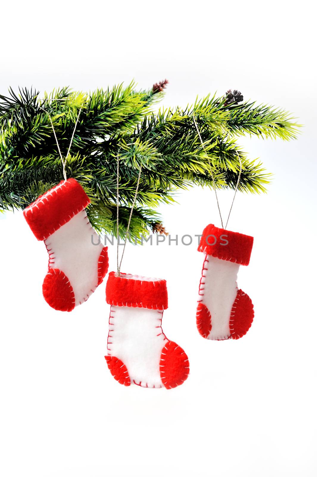 Three Santa's boots on christmas tree
