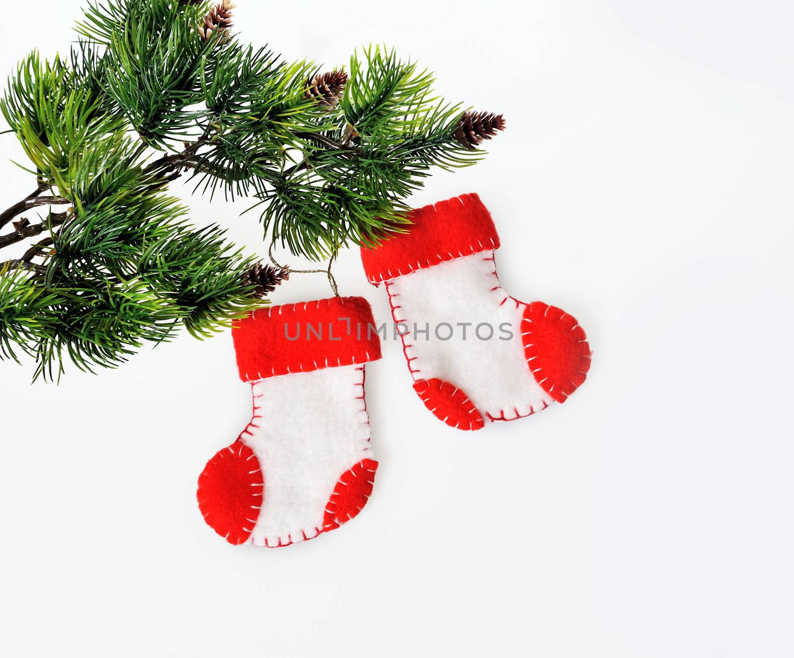 Two Santa's boots on christmas tree