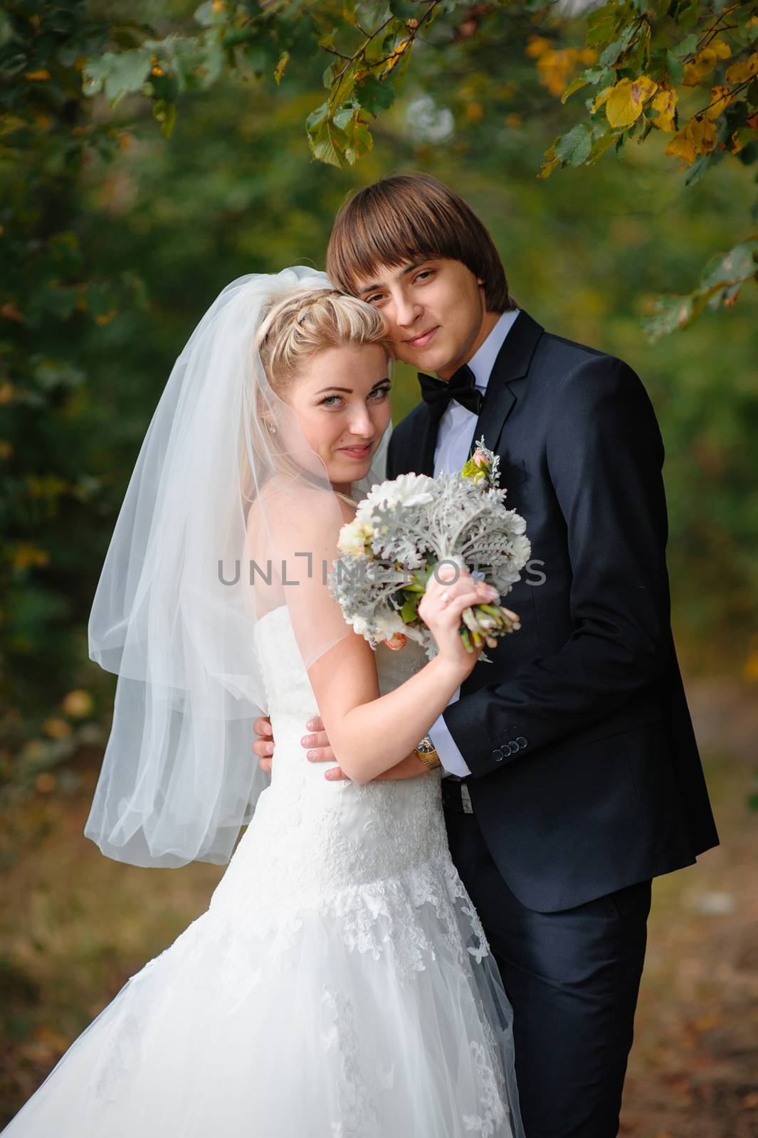 Happy bride and groom at a wedding in the park