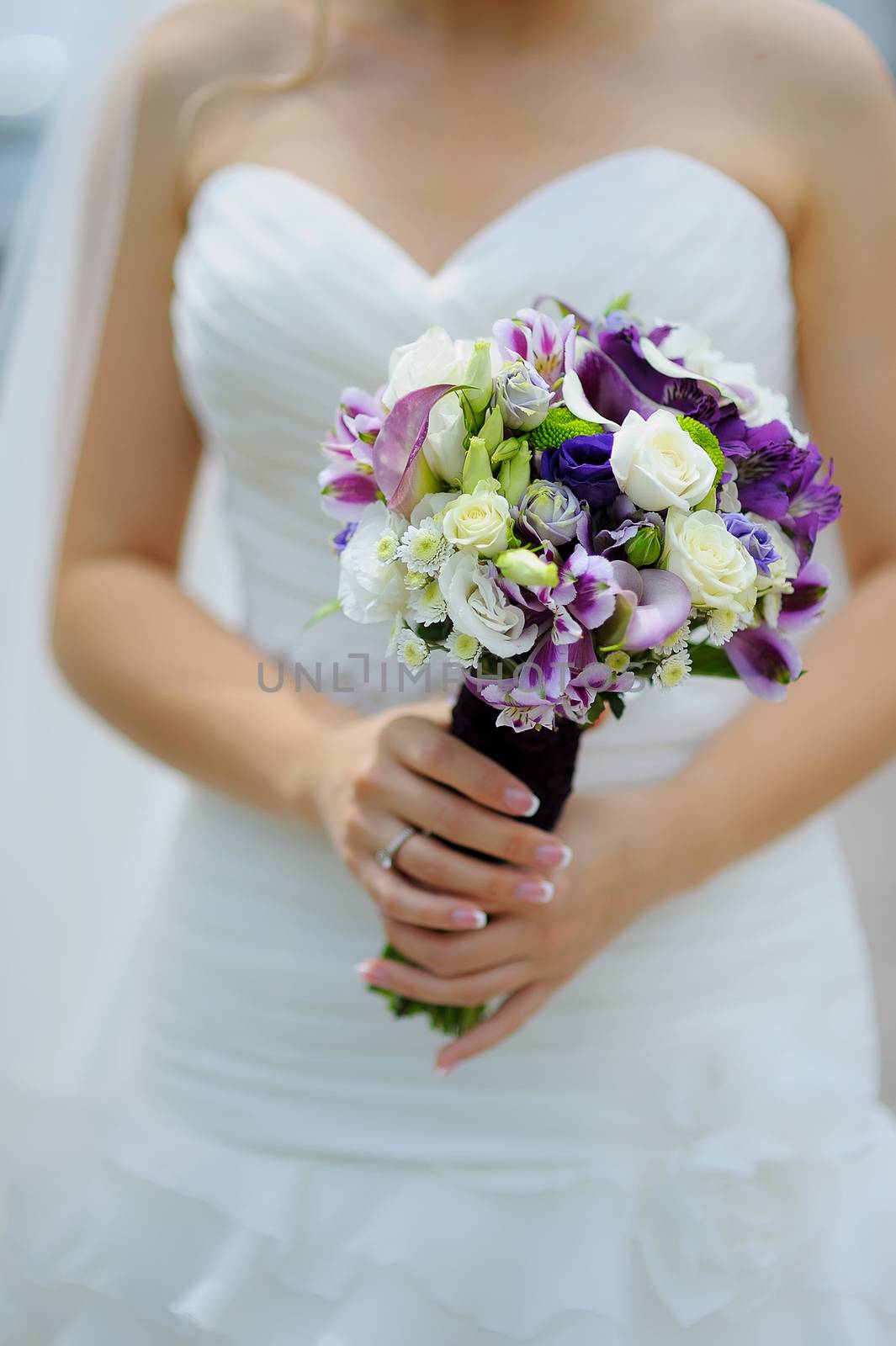 wedding bouquet in hands of the bride