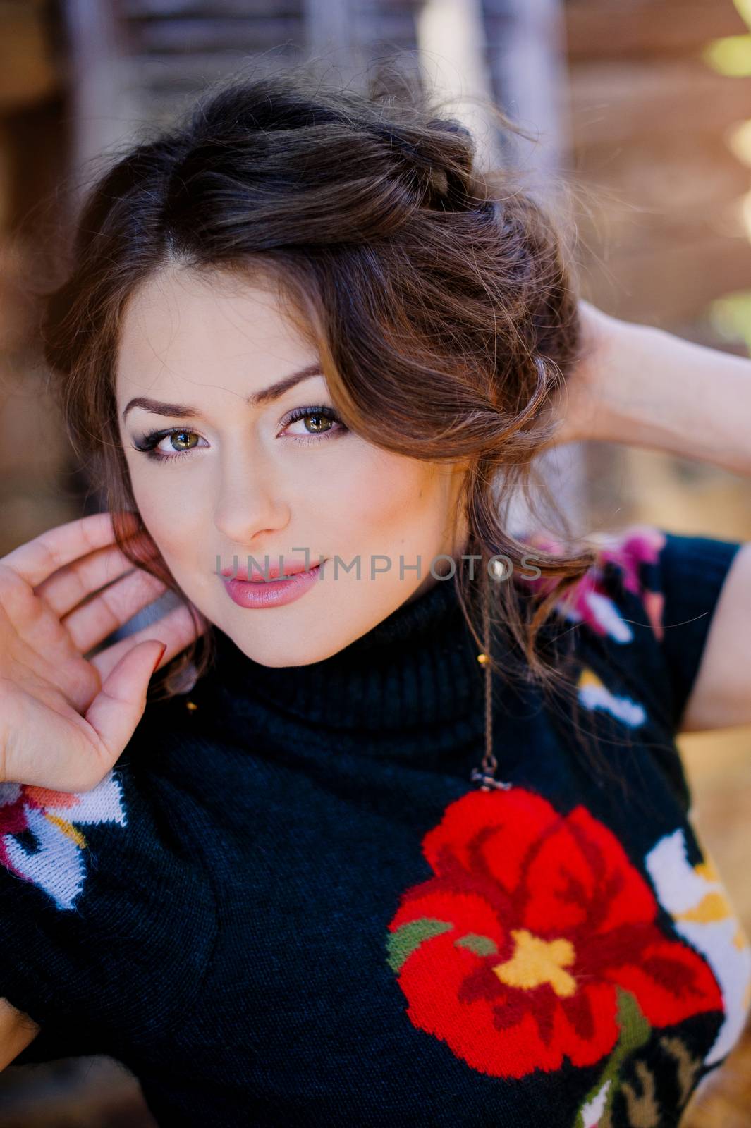 Closeup portrait of beautiful young woman lying on floor and loo by timonko