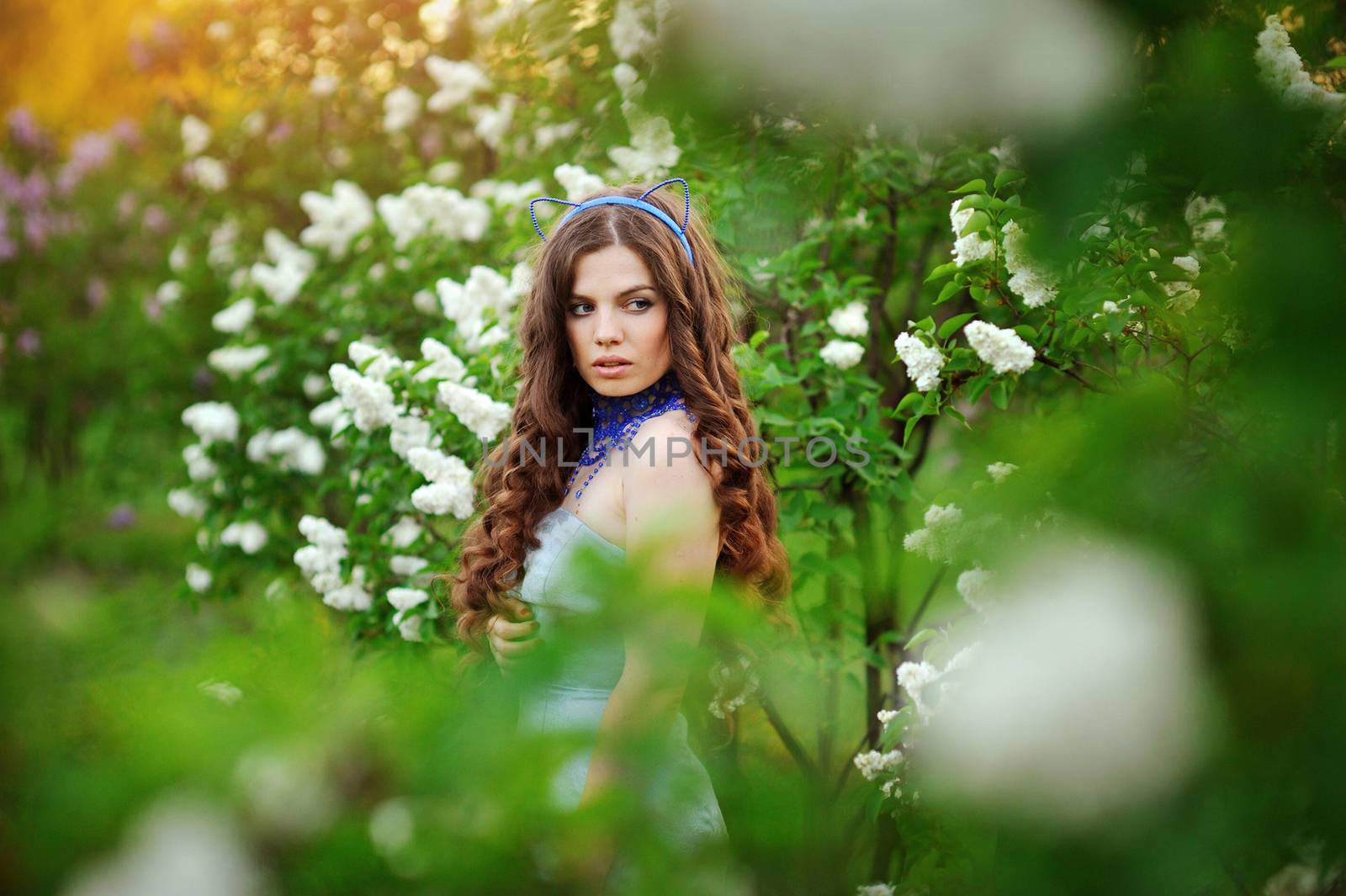 young woman with lilac flowers 