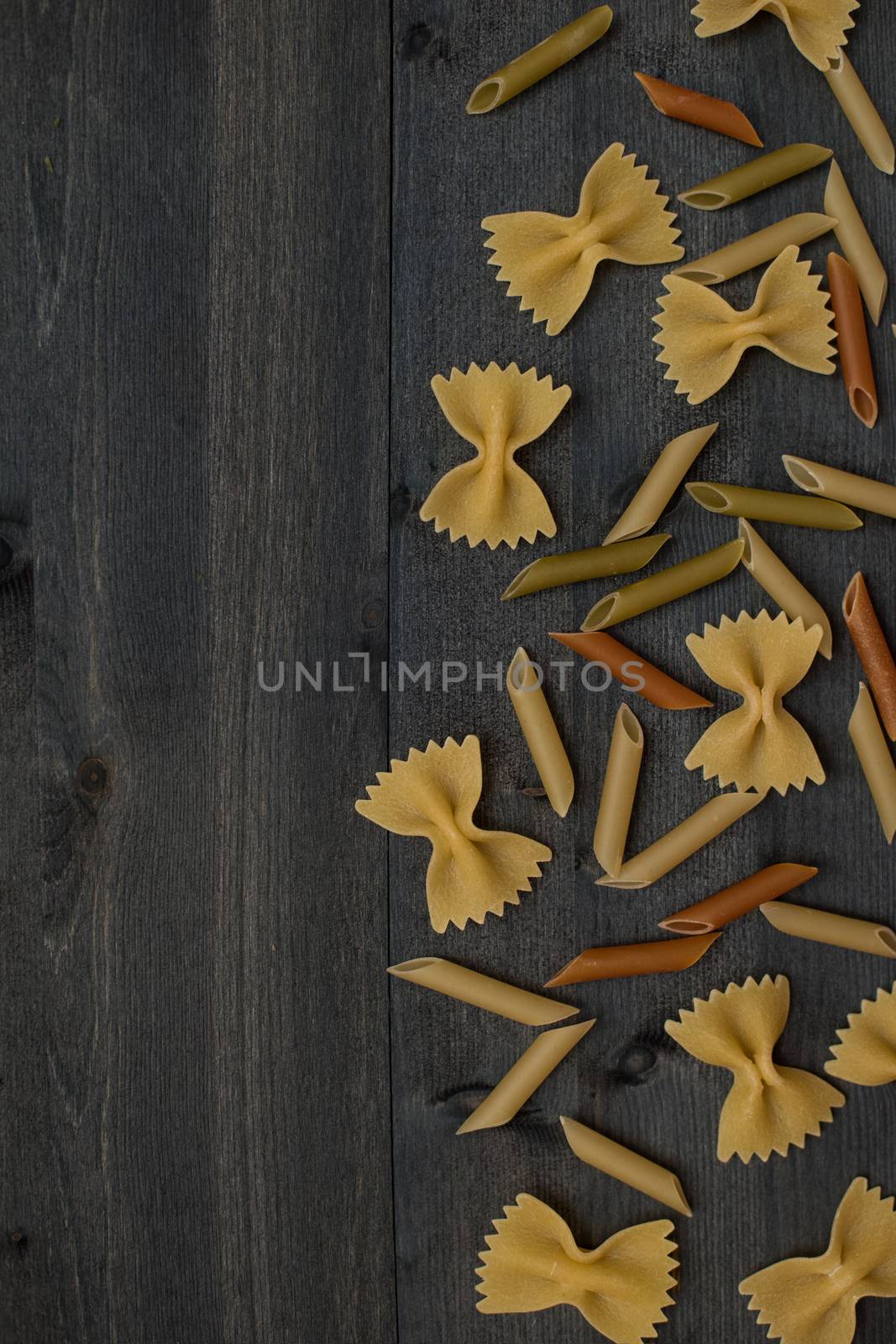 Pasta collection on rustic dark wooden background