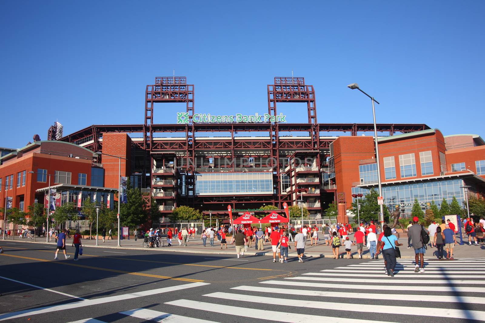 Fans arrive at the Phillies concrete and old fashioned brick ballpark in South Philadelphia sports complex.