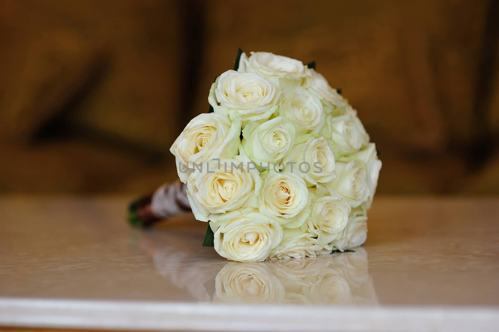 White wedding flowers on wooden table by timonko