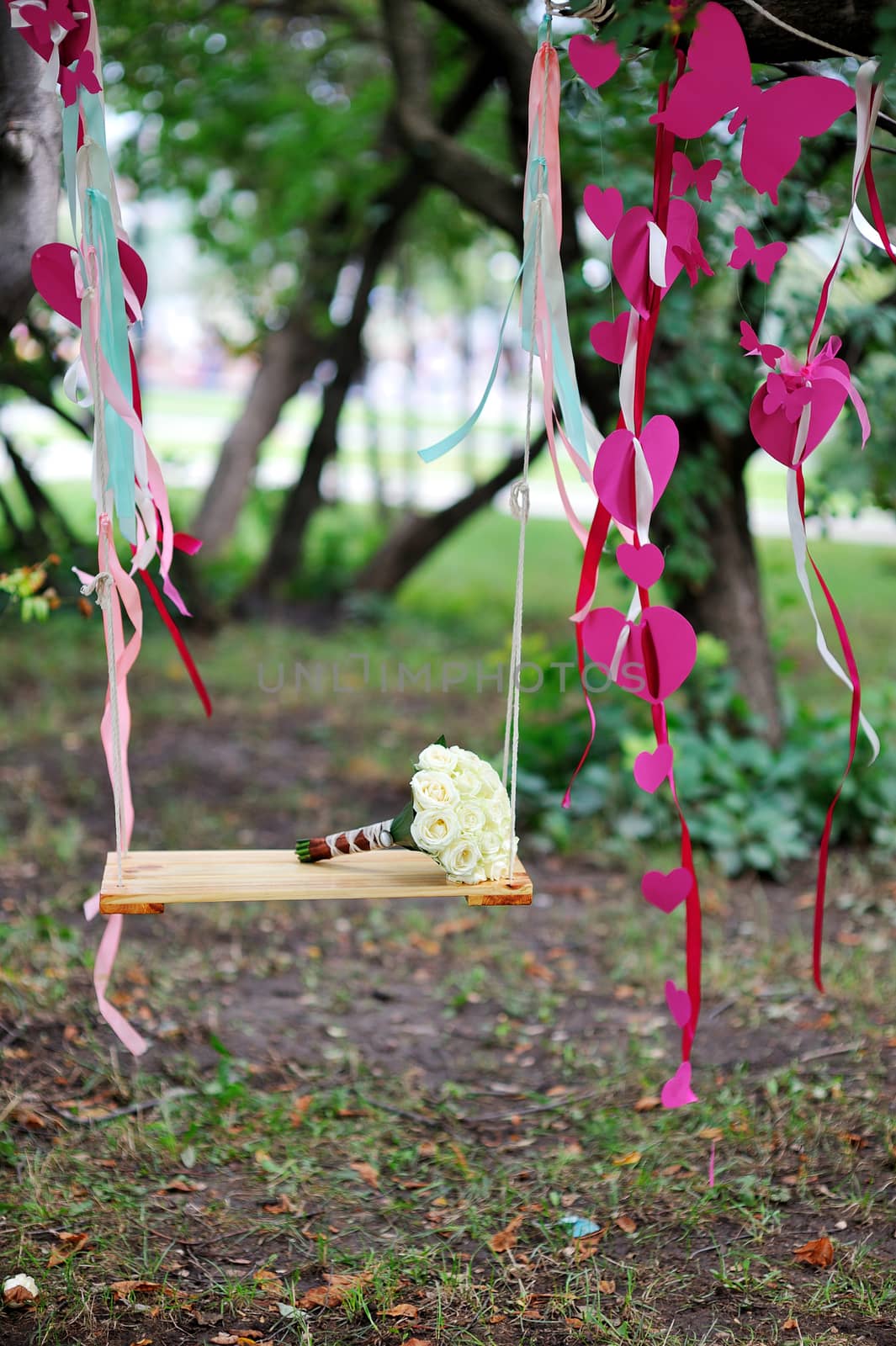 bridal bouquet lying on the swing