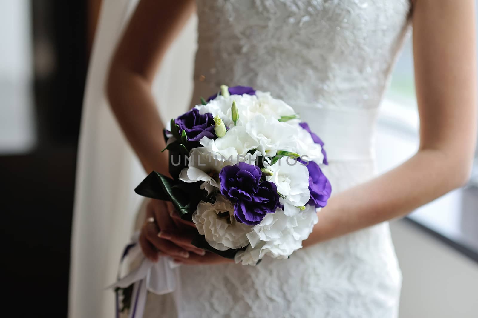 Beautiful wedding bouquet in hands of the bride by timonko