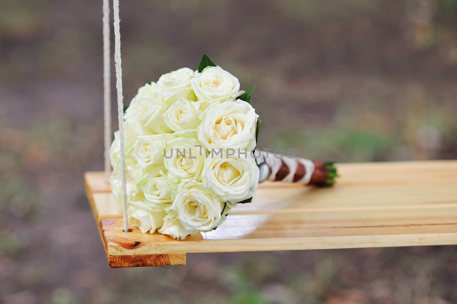 bridal bouquet on swing by timonko