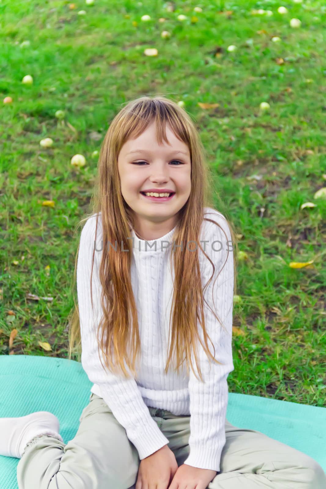 Photo of cute smiling girl with long hair