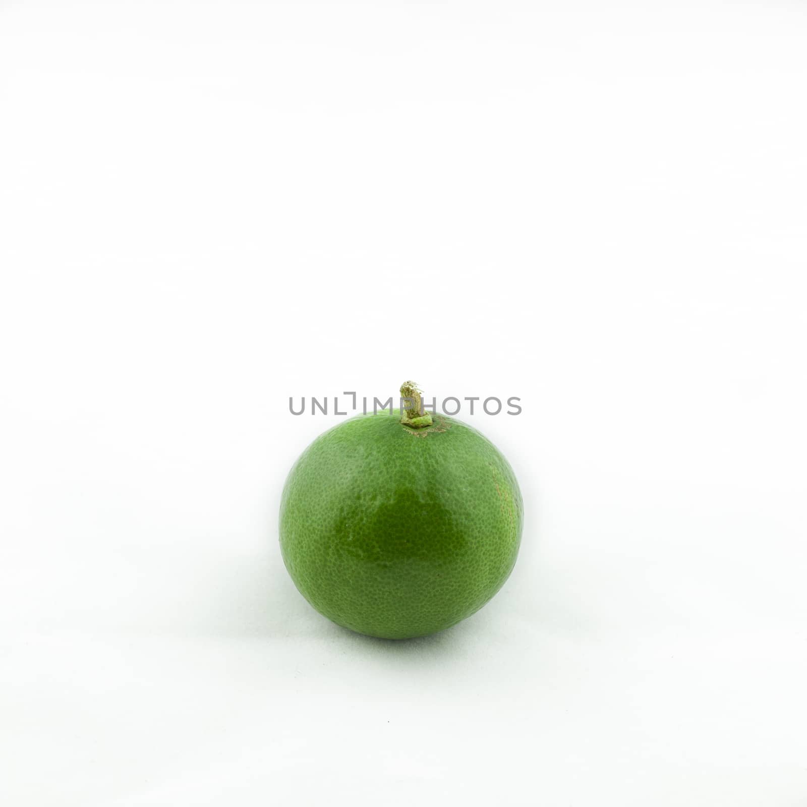 Fresh green lemon isolated on white background. Natural product. Sliced lemon.