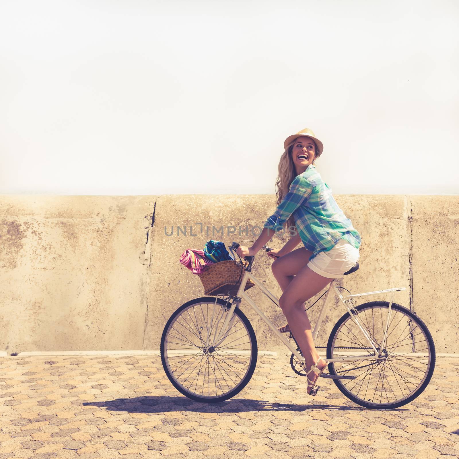Cute blonde on a bike ride by Wavebreakmedia