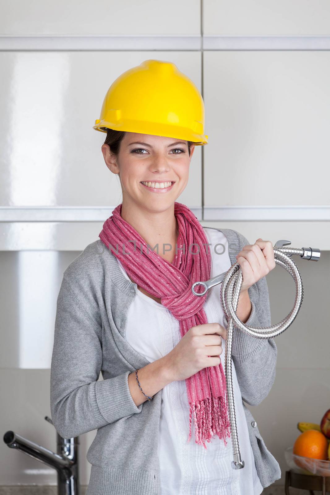 Happy plumber woman