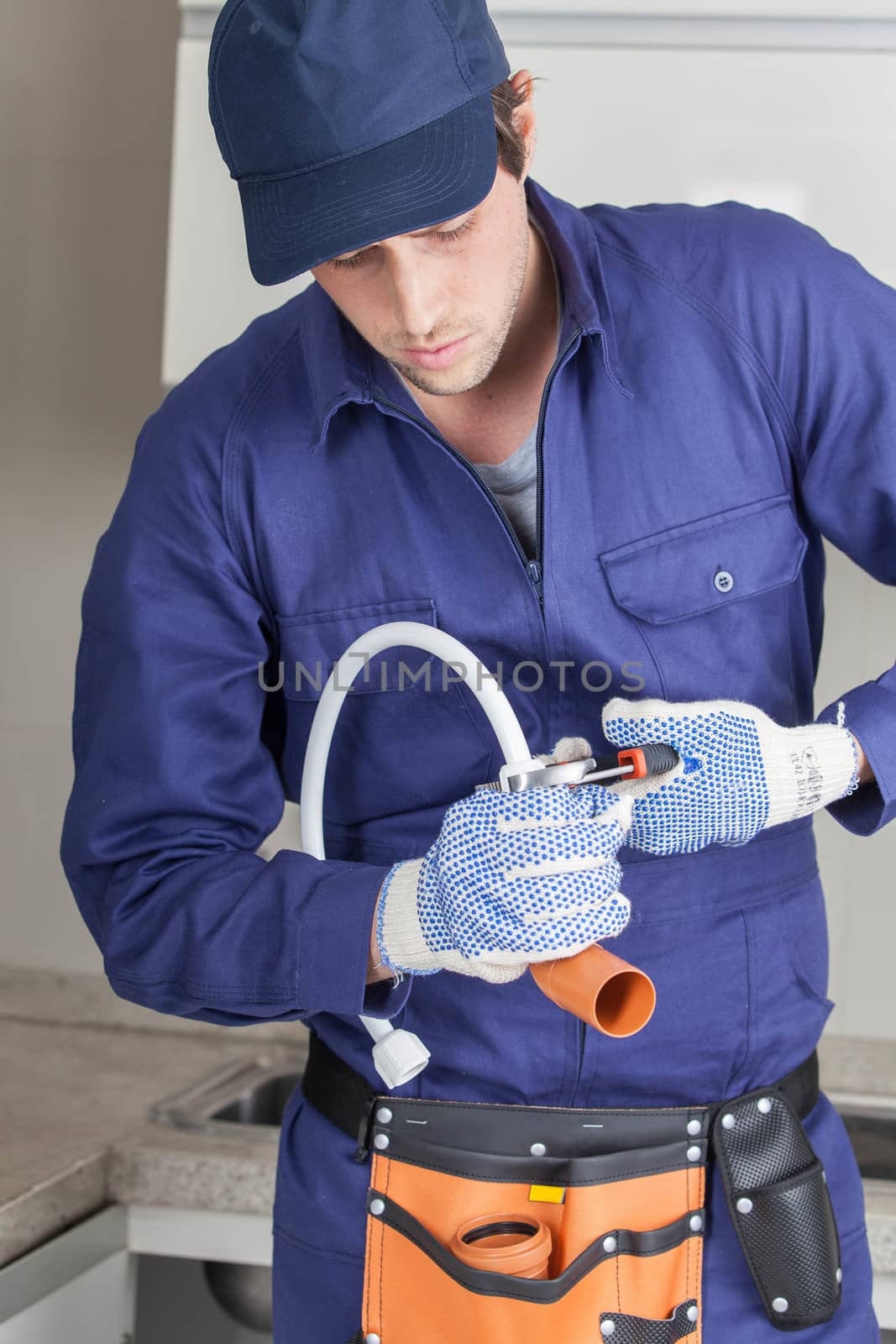 The plumber fixing a pipe