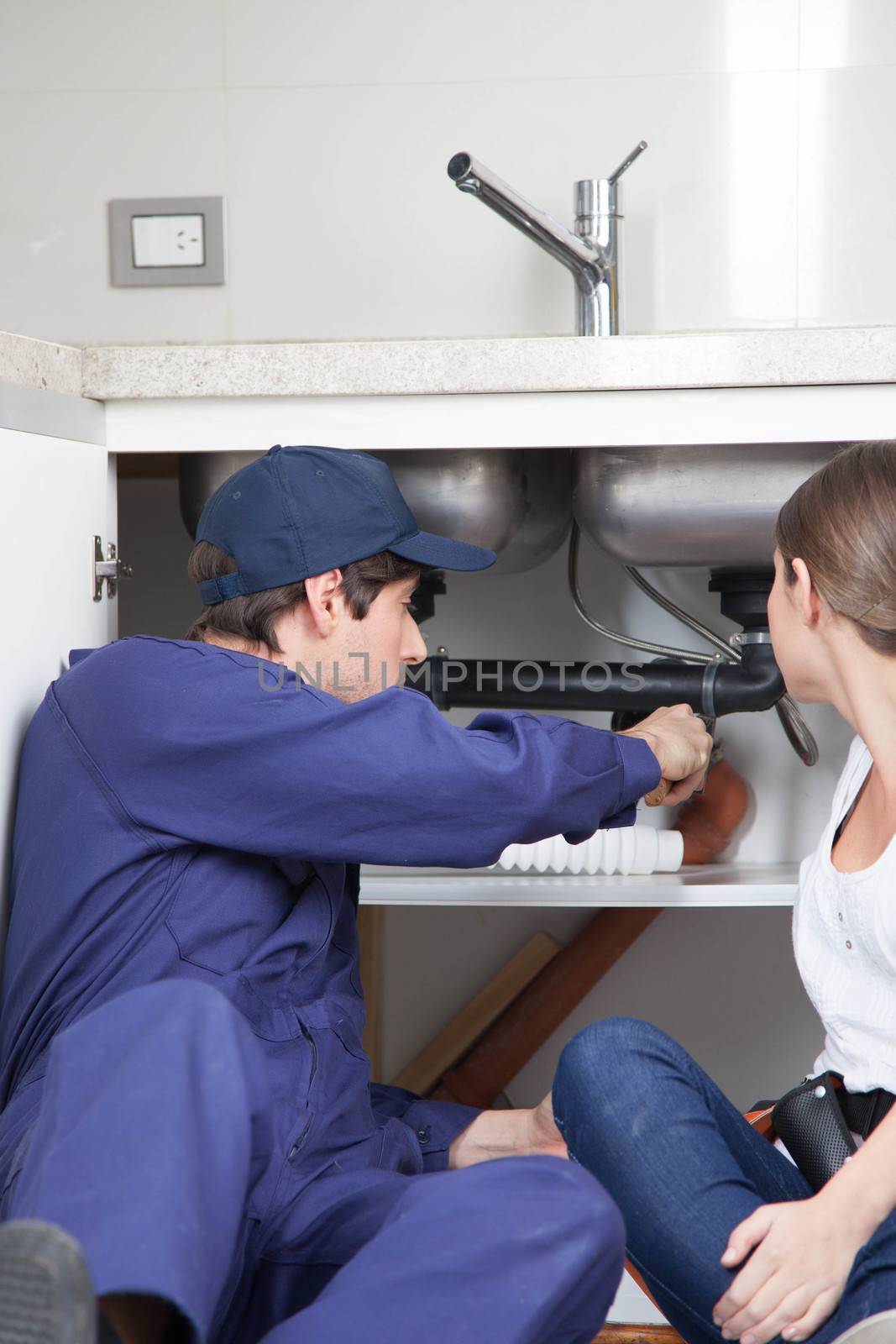 Plumbers couple reviewing the washing