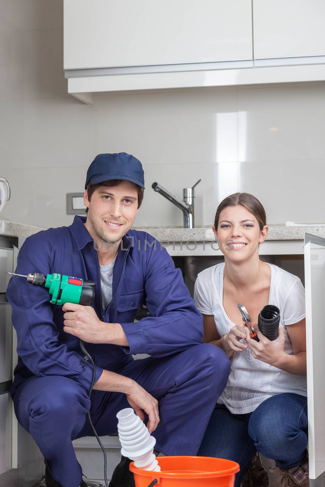 Pair of plumbers working happily