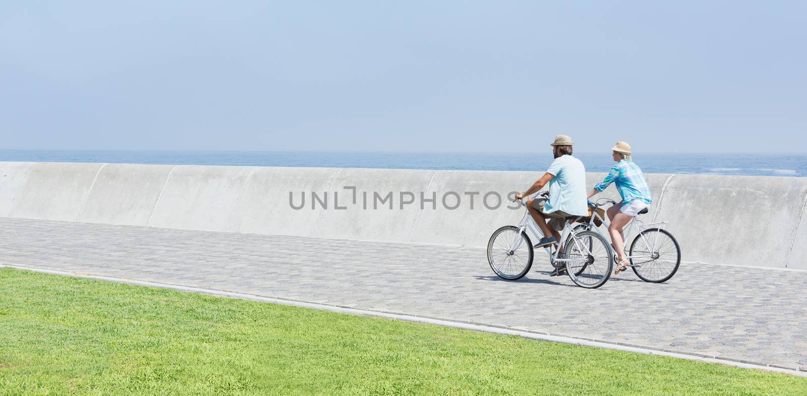 Cute couple on a bike ride on a sunny day