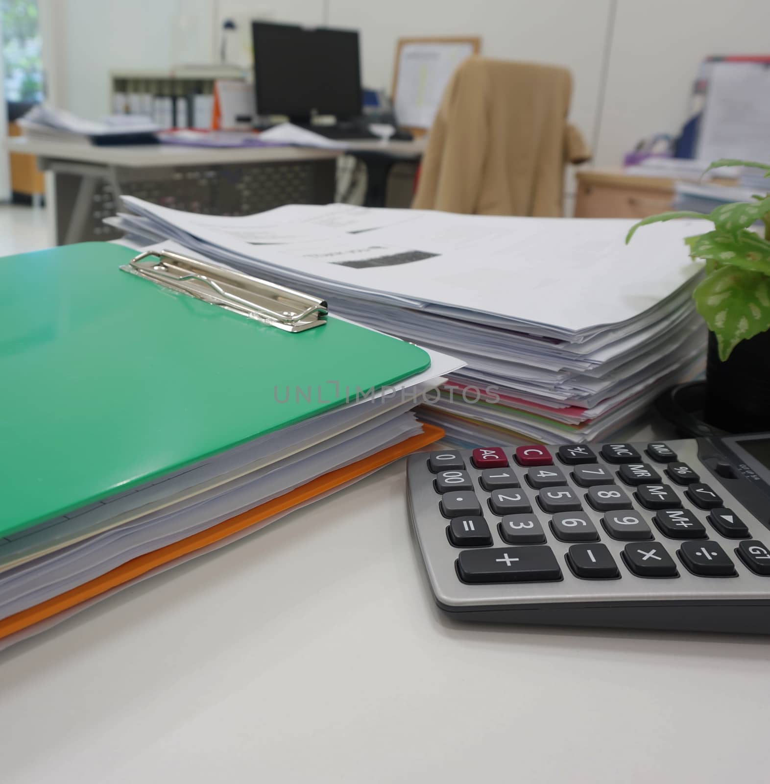 Pile of paperwork  and office supply placed on table in workplace.                             