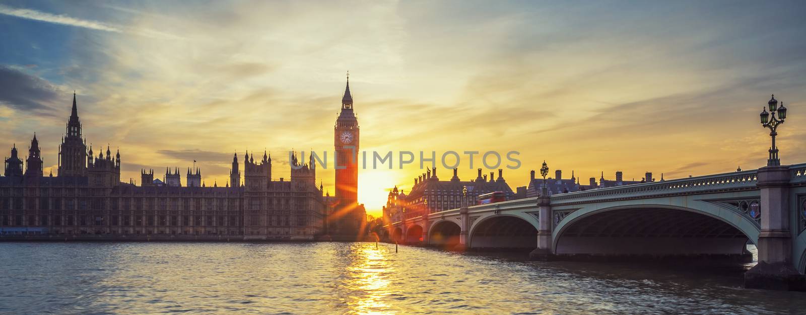 Famous Big Ben clock tower in London at sunset, panoramic view, UK.