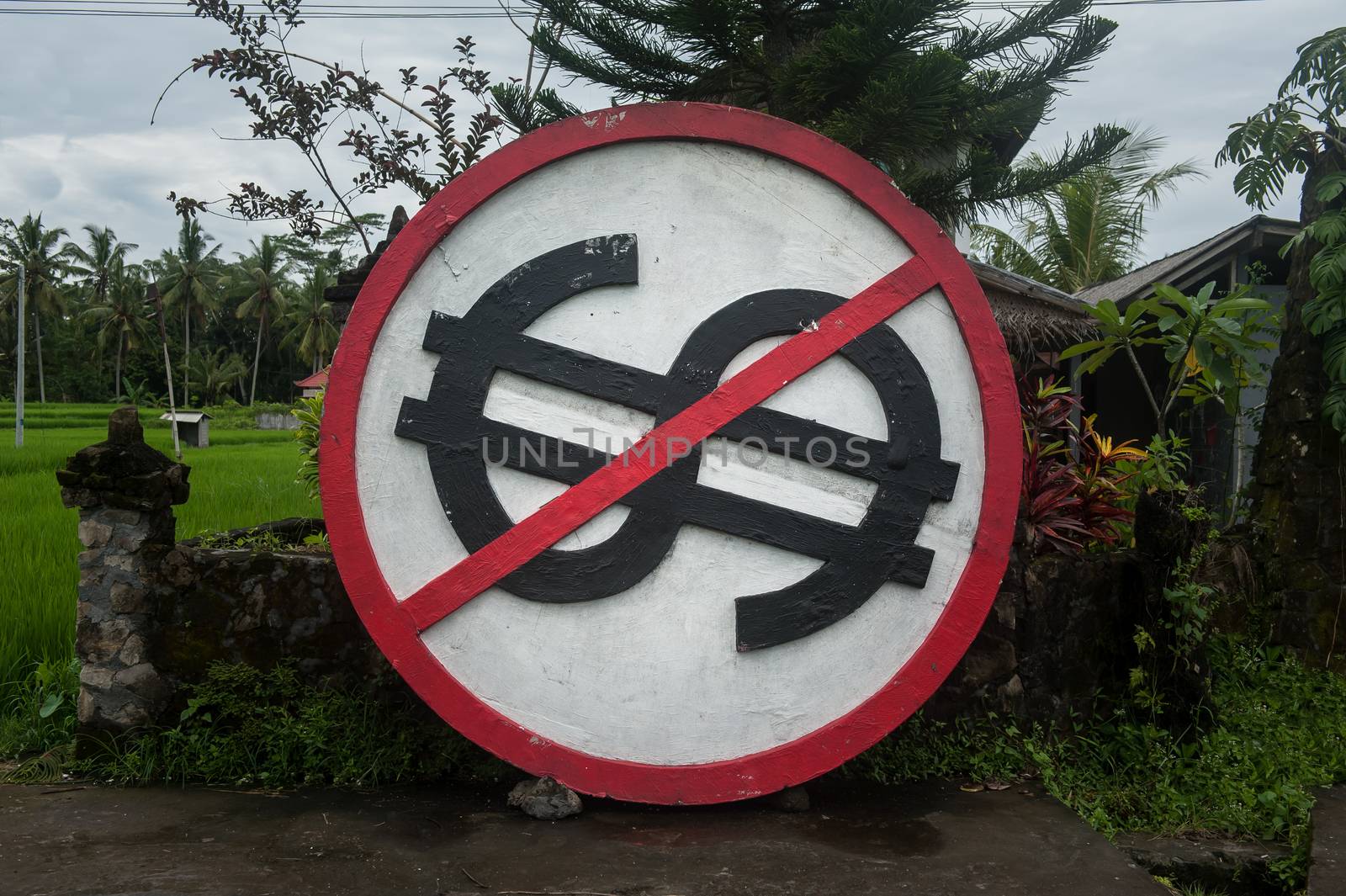 Dollar prohibition sign, placed in Ubud, Bali, Indonesia, for the reason that foreigners are not allowed to buy the lands of Indonesia.