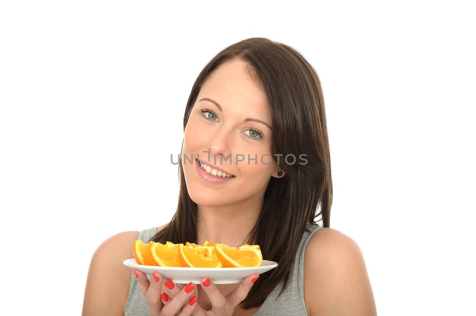 Attractive Young Woman Holding a Plate of Sliced Fresh Juicy Oranges Segments