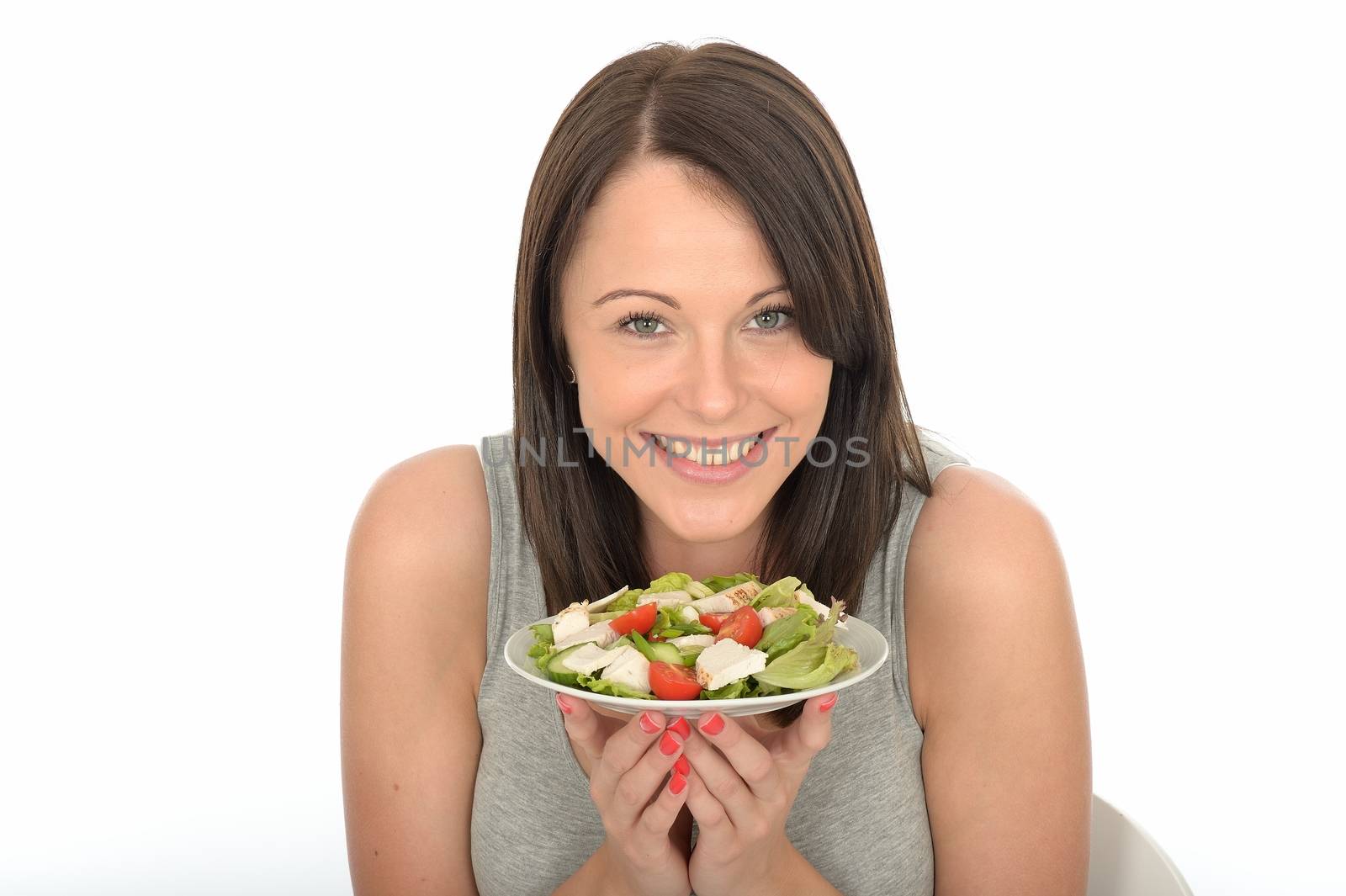 Attractive Healthy Young Woman Holding a Plate of Chicken with Mixed Fresh Salad