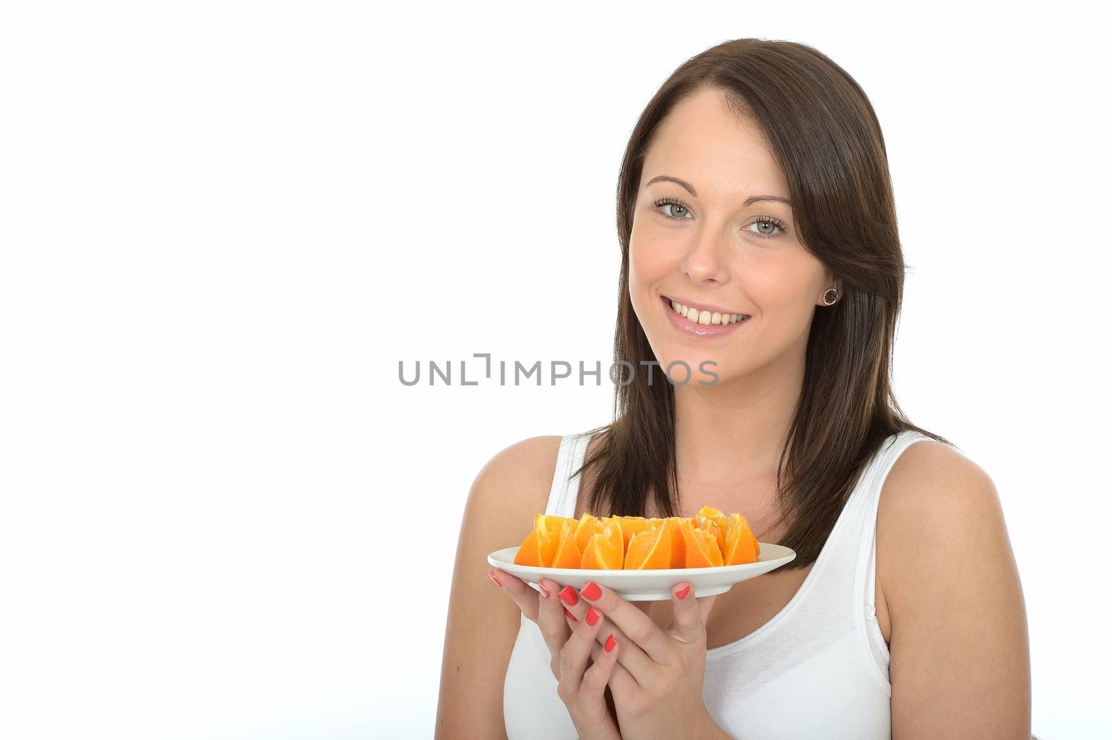 Healthy Young Woman Holding a Plate of Fresh Orange Segments by Whiteboxmedia