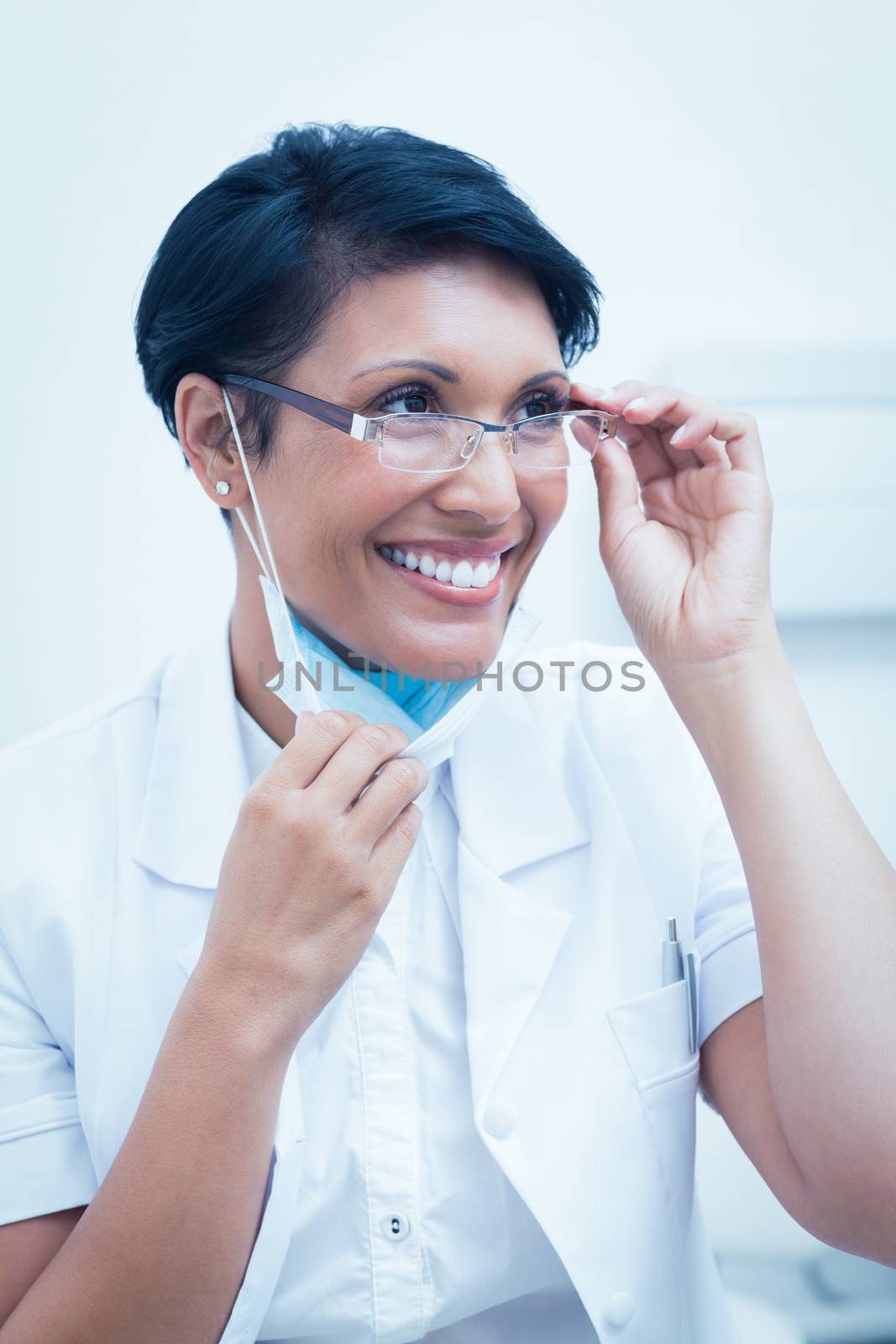 Confident female dentist smiling by Wavebreakmedia