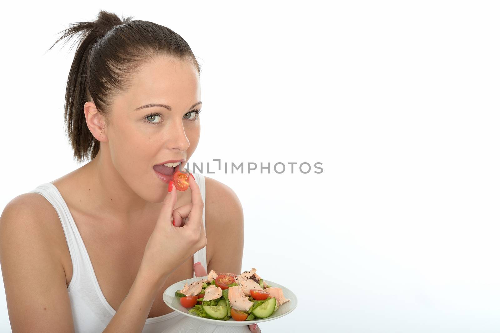 Healthy Happy Young Woman Holding a Plate of Poached Salmon and Mixed Salad