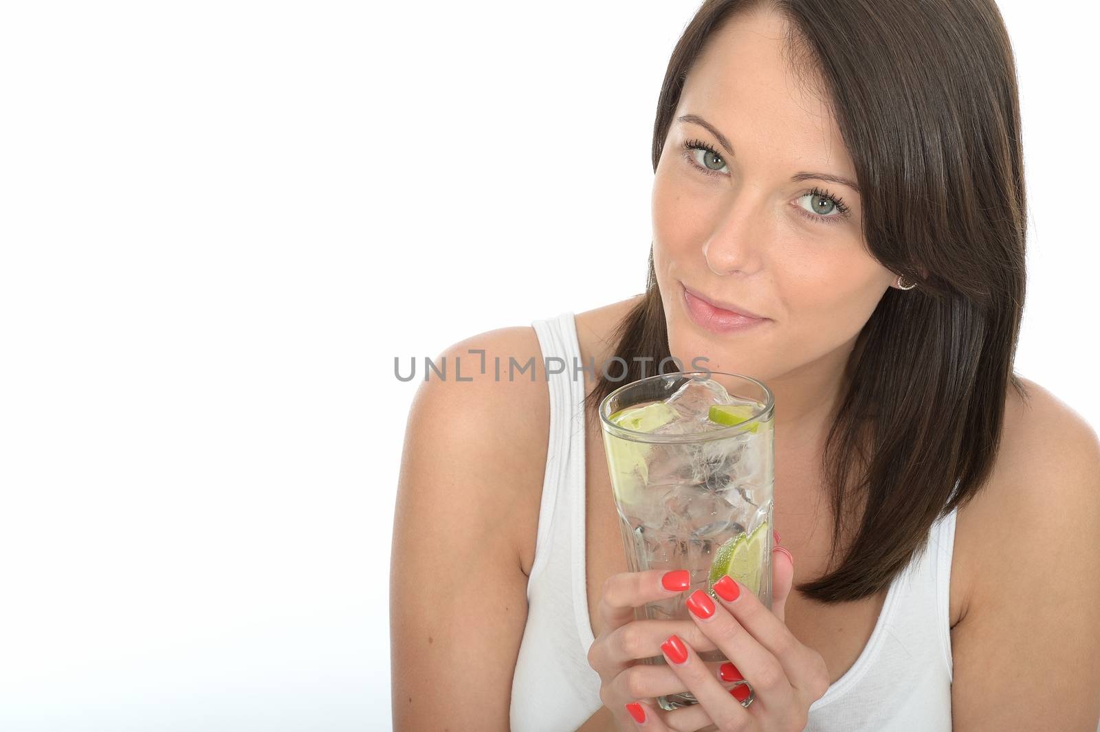 Healthy Young Woman Holding a Glass of Iced Water with Lime
