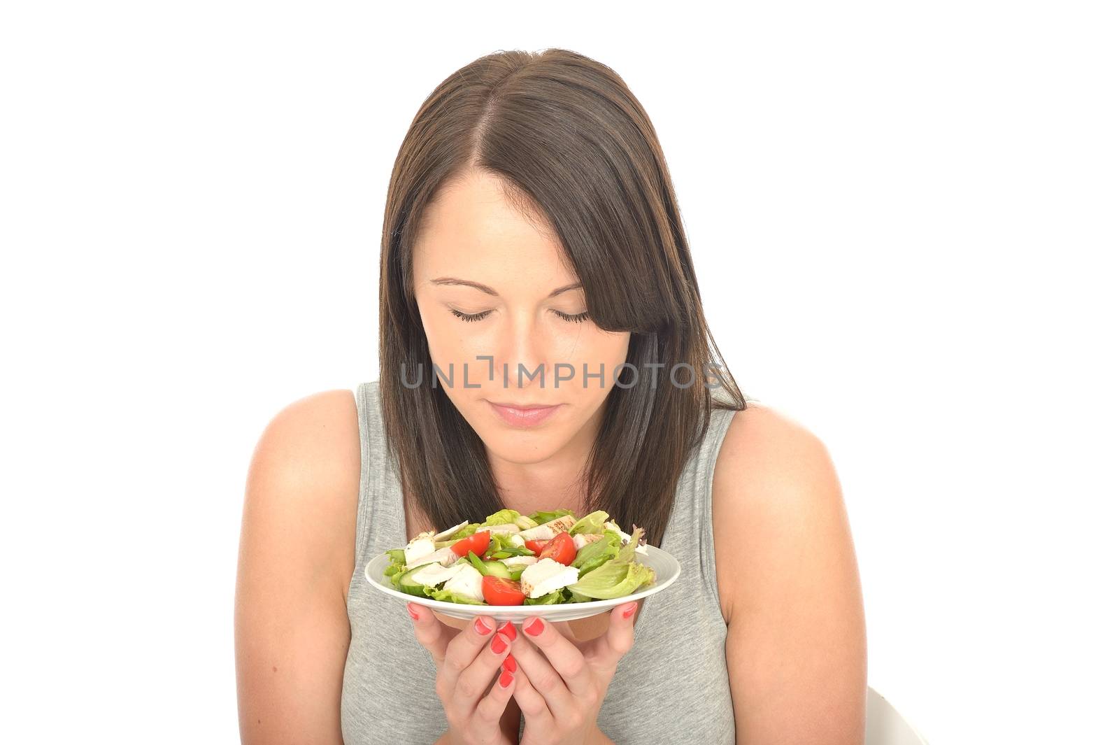 Attractive Healthy Young Woman Holding a Plate of Chicken with Mixed Fresh Salad