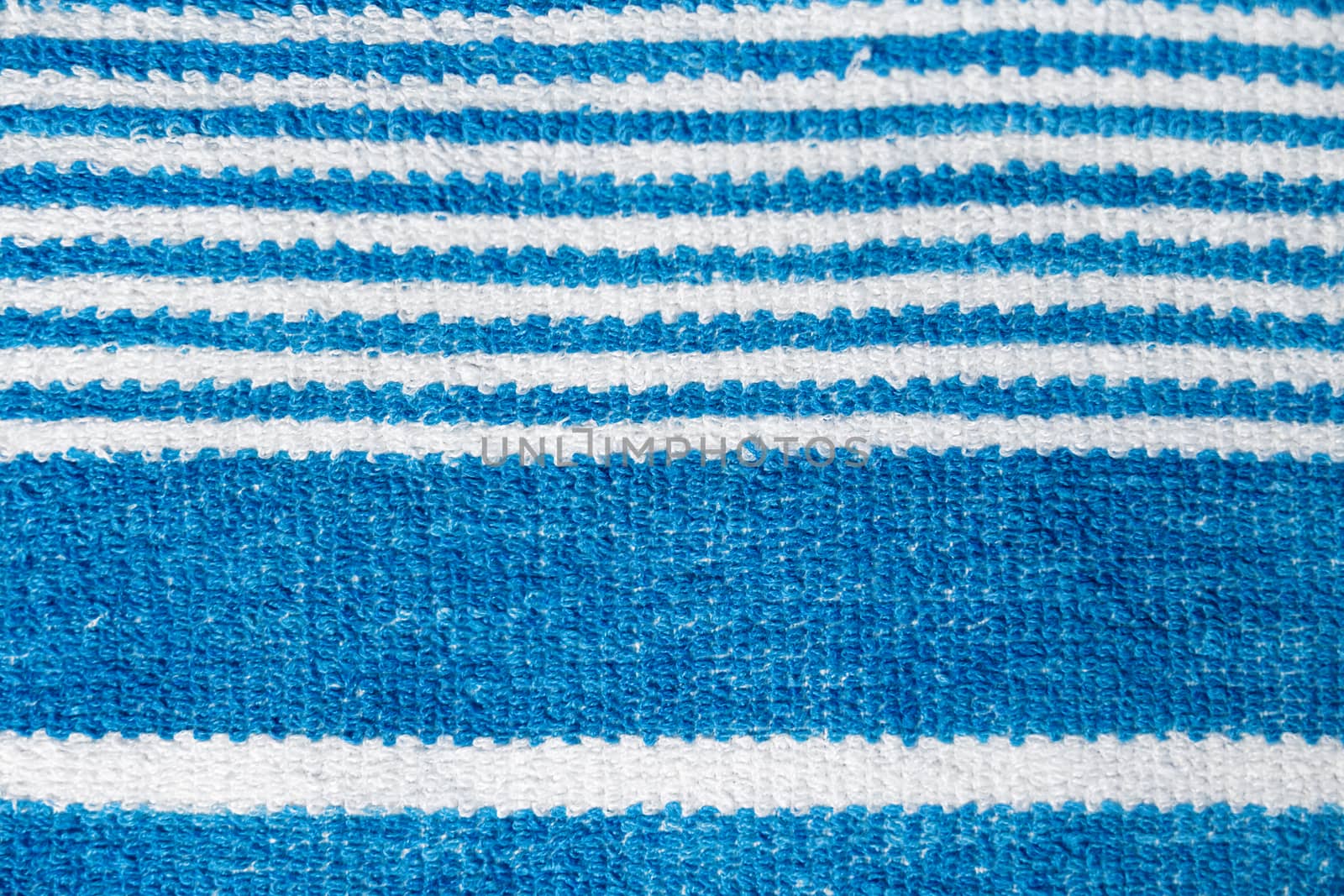 Towel with blue horizontal stripes. macro photography