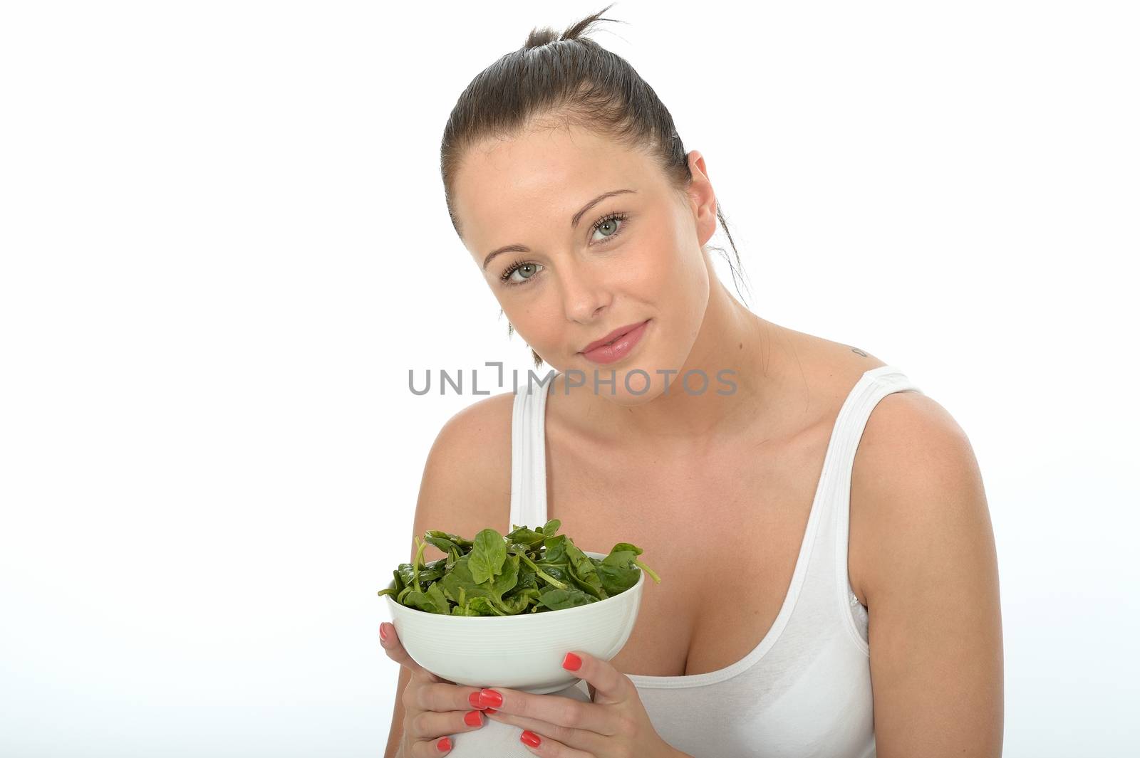 Healthy Happy Attractive Young Woman Holding a Bowl of Spinach