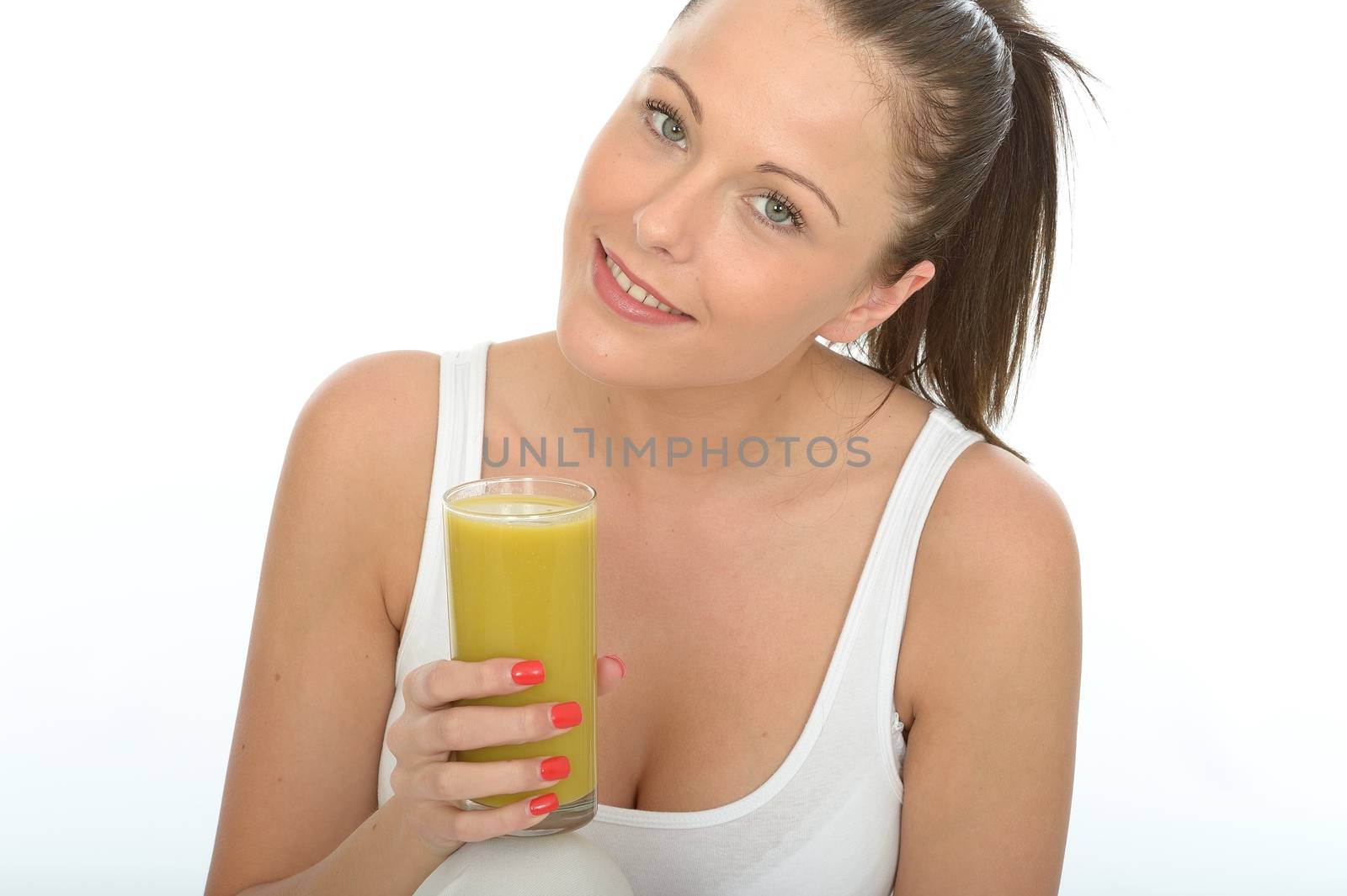 Healthy Attractive Young Woman Holding a Glass of Lime and Mango by Whiteboxmedia