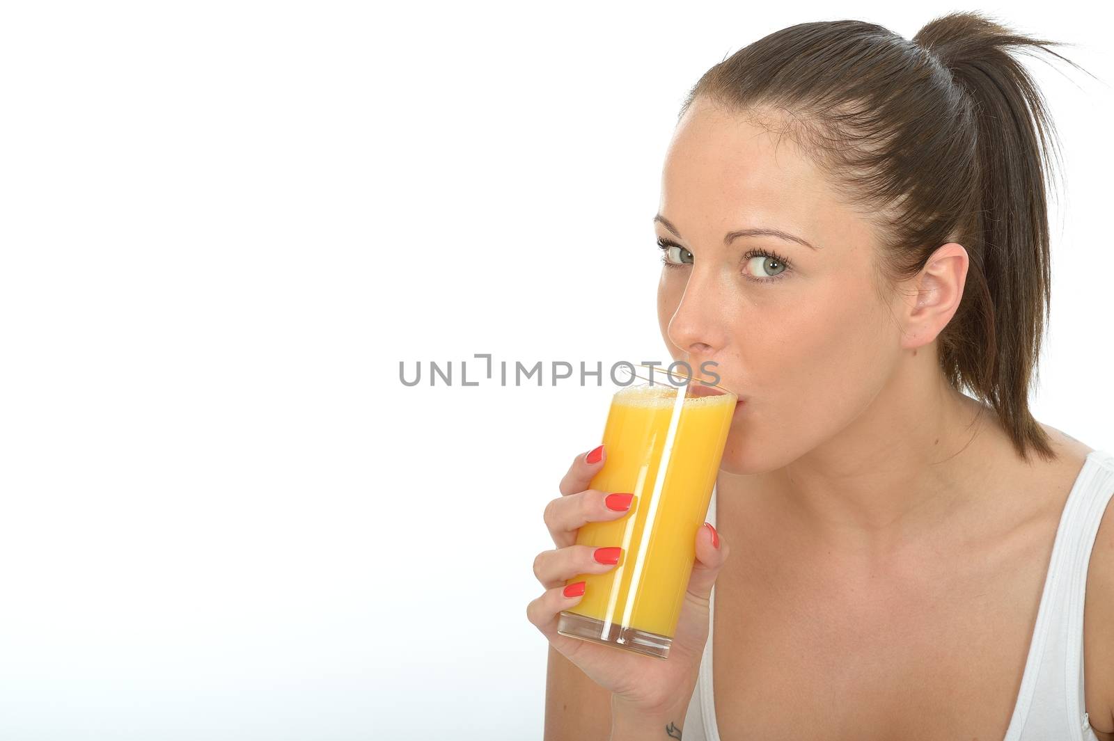Healthy Happy Attractive Fit Young Woman Holding a Glass Of Fresh Organic Orange Juice