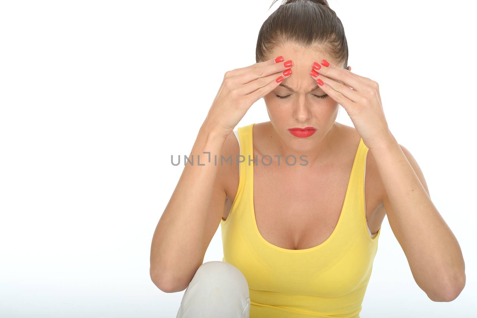 Stressed Young Woman Sitting on the Floor Rubbing Her Forehead by Whiteboxmedia