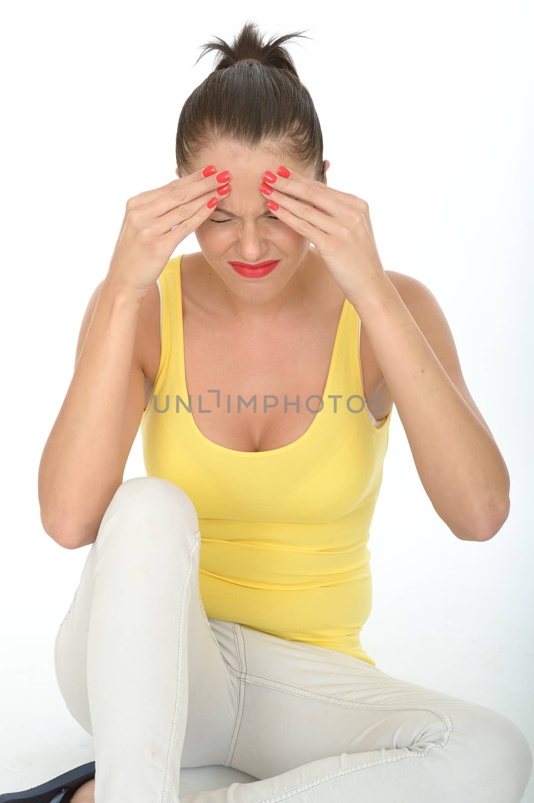 Portrait of a Stressed Young Woman Sitting on the Floor Rubbing Her Forehead