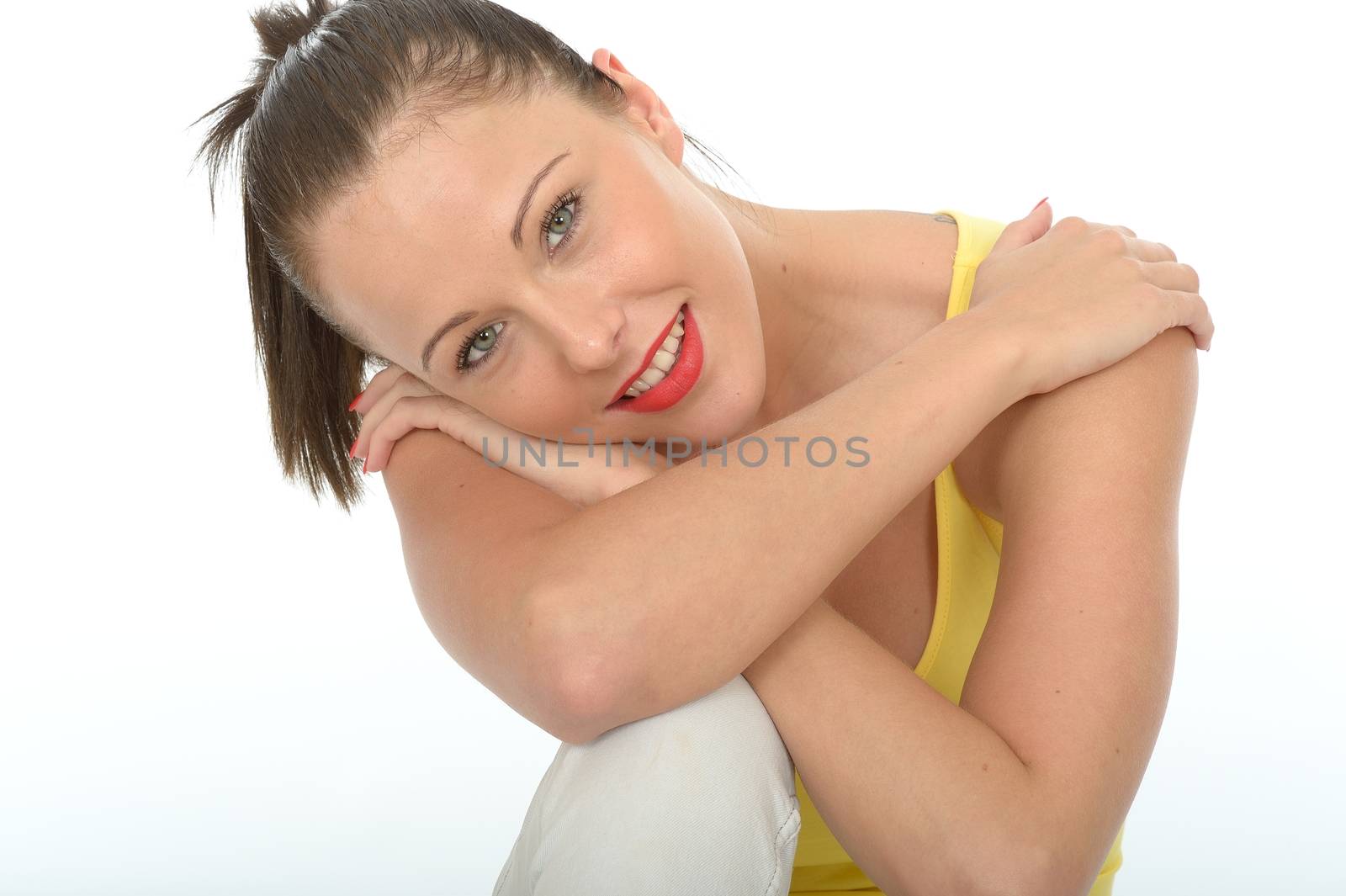 Portrait of a Very Happy Relaxed Contented Attractive Young Woman Wearing a Bright Yellow Vest Top