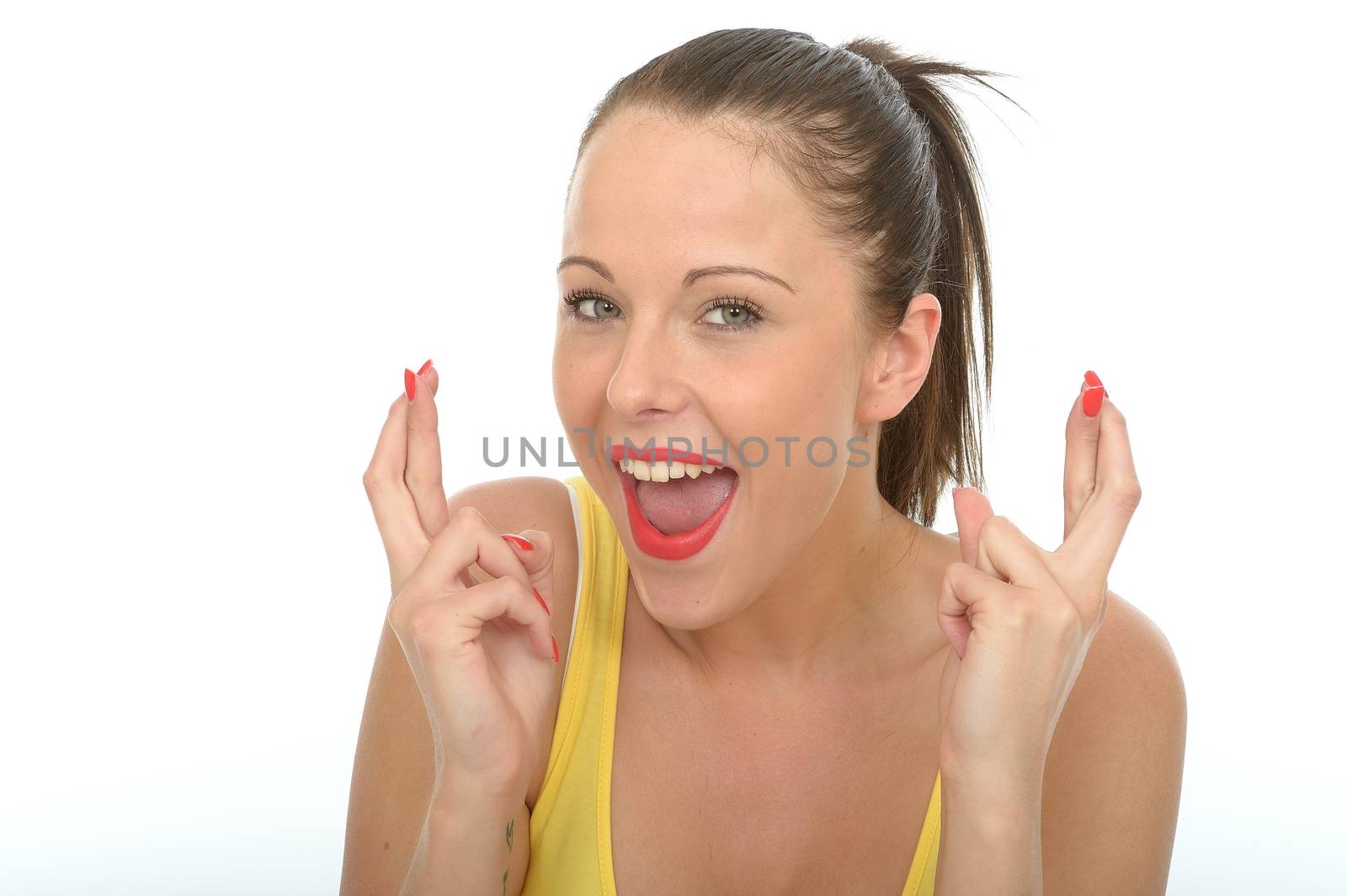 Portrait of a Happy Excited Young Woman With Her Fingers Crossed