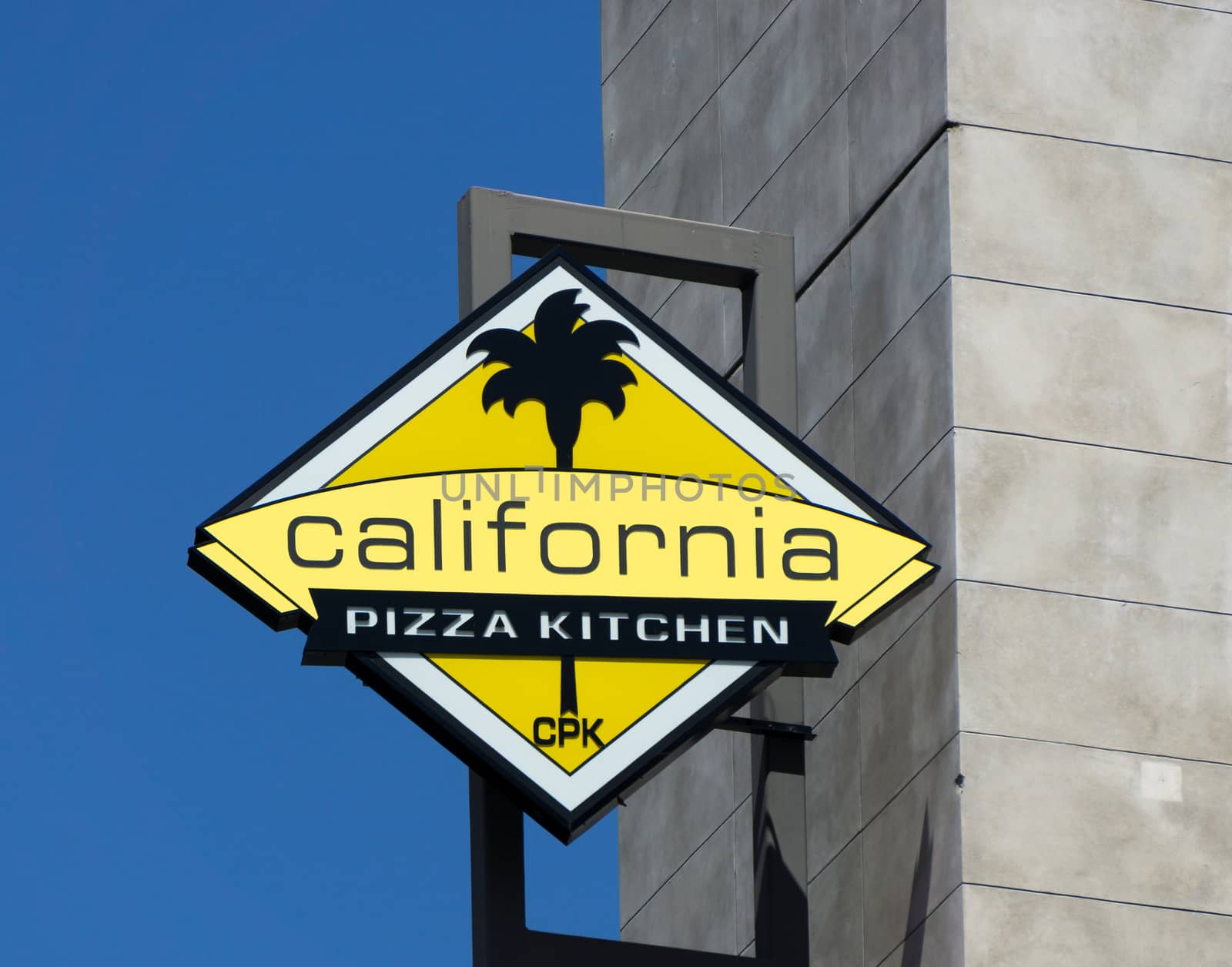 HOLLYWOOD, CA/USA - APRIL 18, 2015: California Pizza Kitchen sign and logo. California Pizza Kitchen is a casual dining restaurant chain that specializes in New York-style pizza.