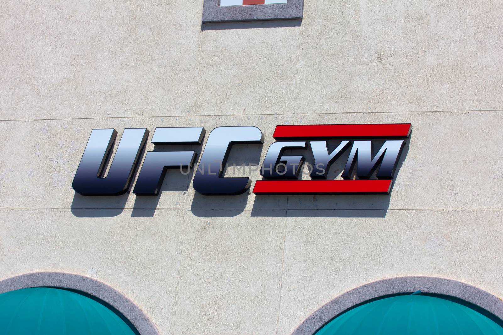 SANTA CLARITA, CA/USA - APRIL 11, 2015: UFC Gym exterior and logo. UFC Gym is an exercise, boxing and mixed martial arts franchise in the United States.