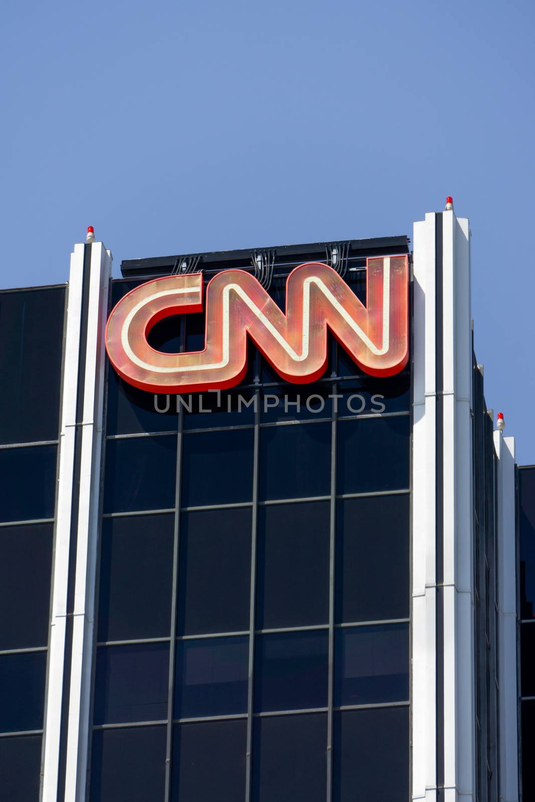 HOLLYWOOD, CA/USA - APRIL 18, 2015: CNN building exterior and logo. Cable News Network (CNN) is an American basic cable and satellite television channel that is owned by Time Warner.