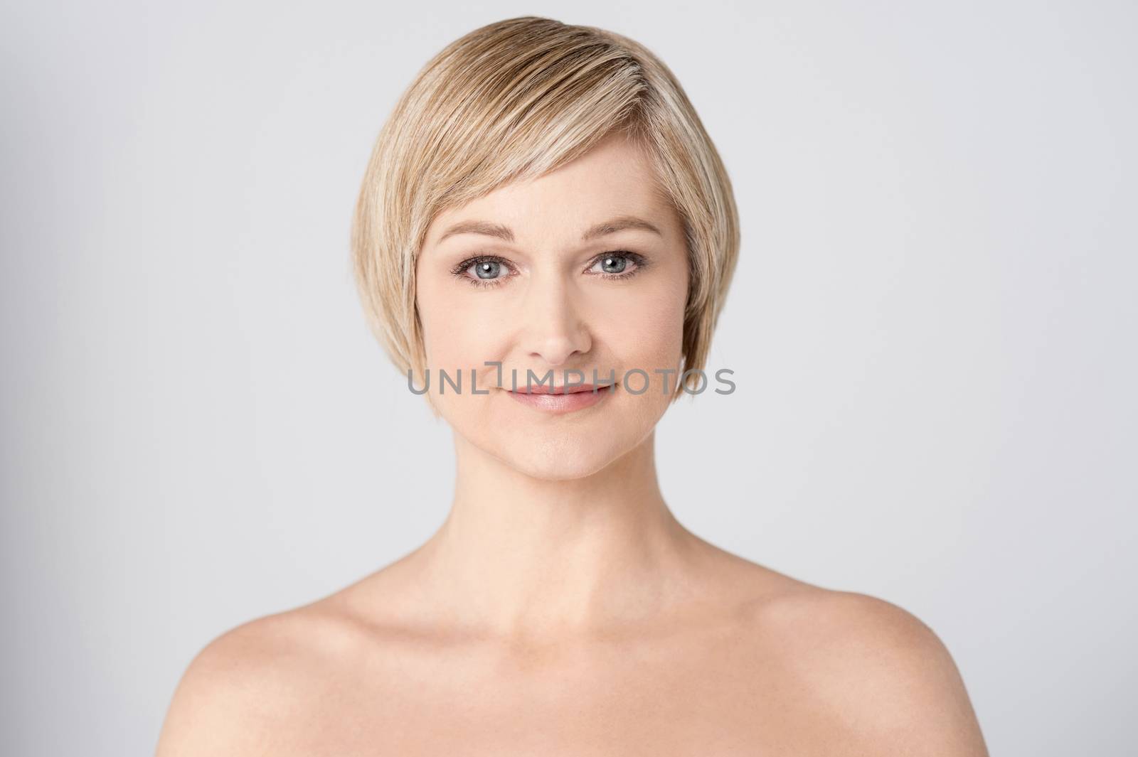 Bare shoulder woman posing to camera