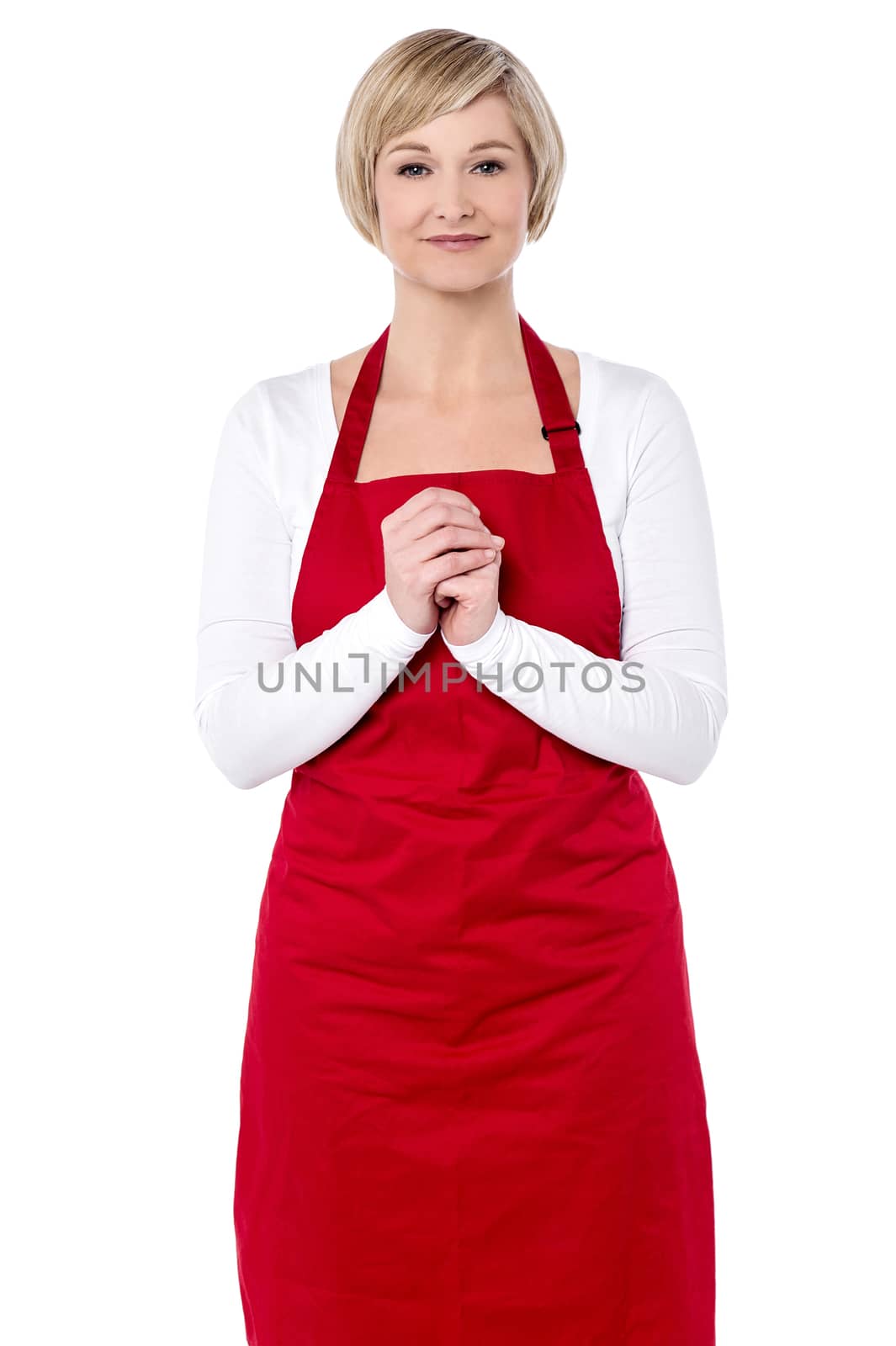 Beautiful woman chef posing with hands clasped