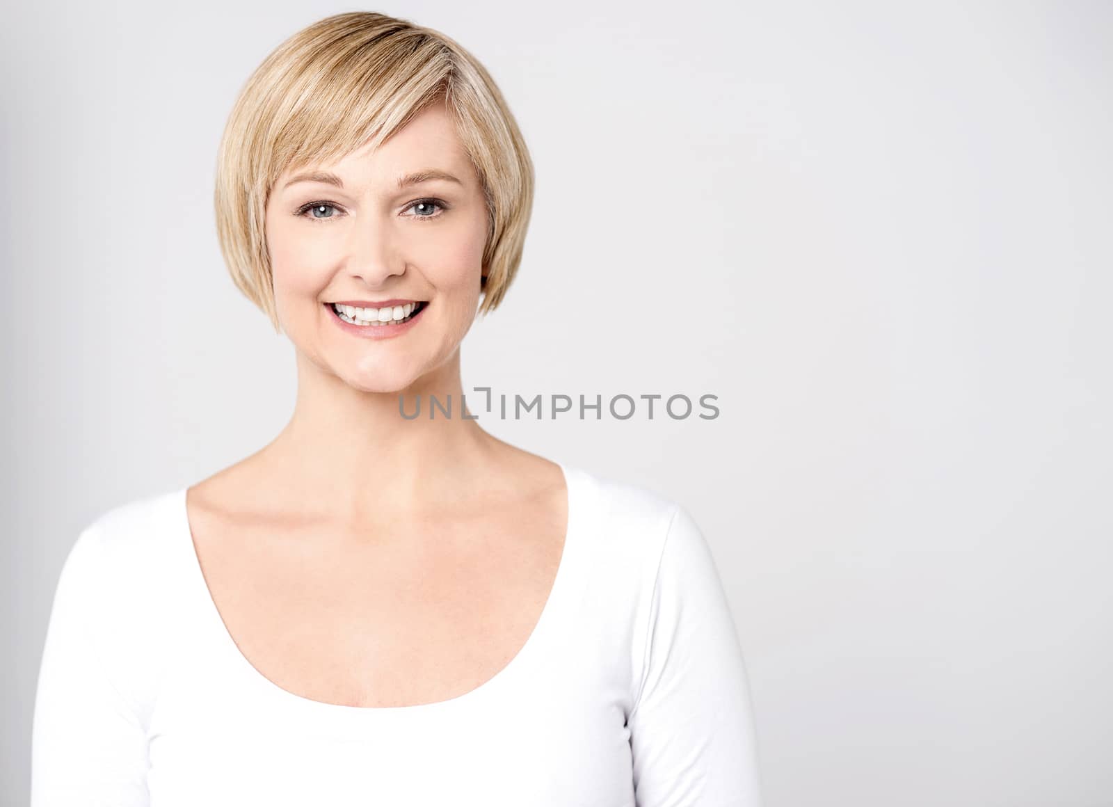 Attractive woman posing to camera over white